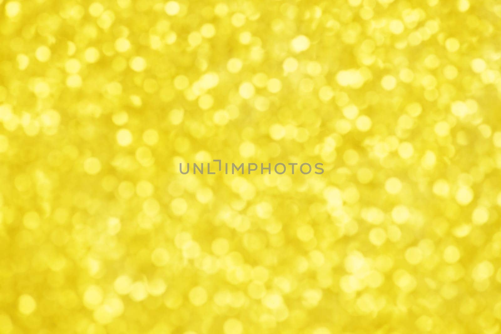 Golden bokeh background for christmas, defocused round lights and sunbeams, flare overlay