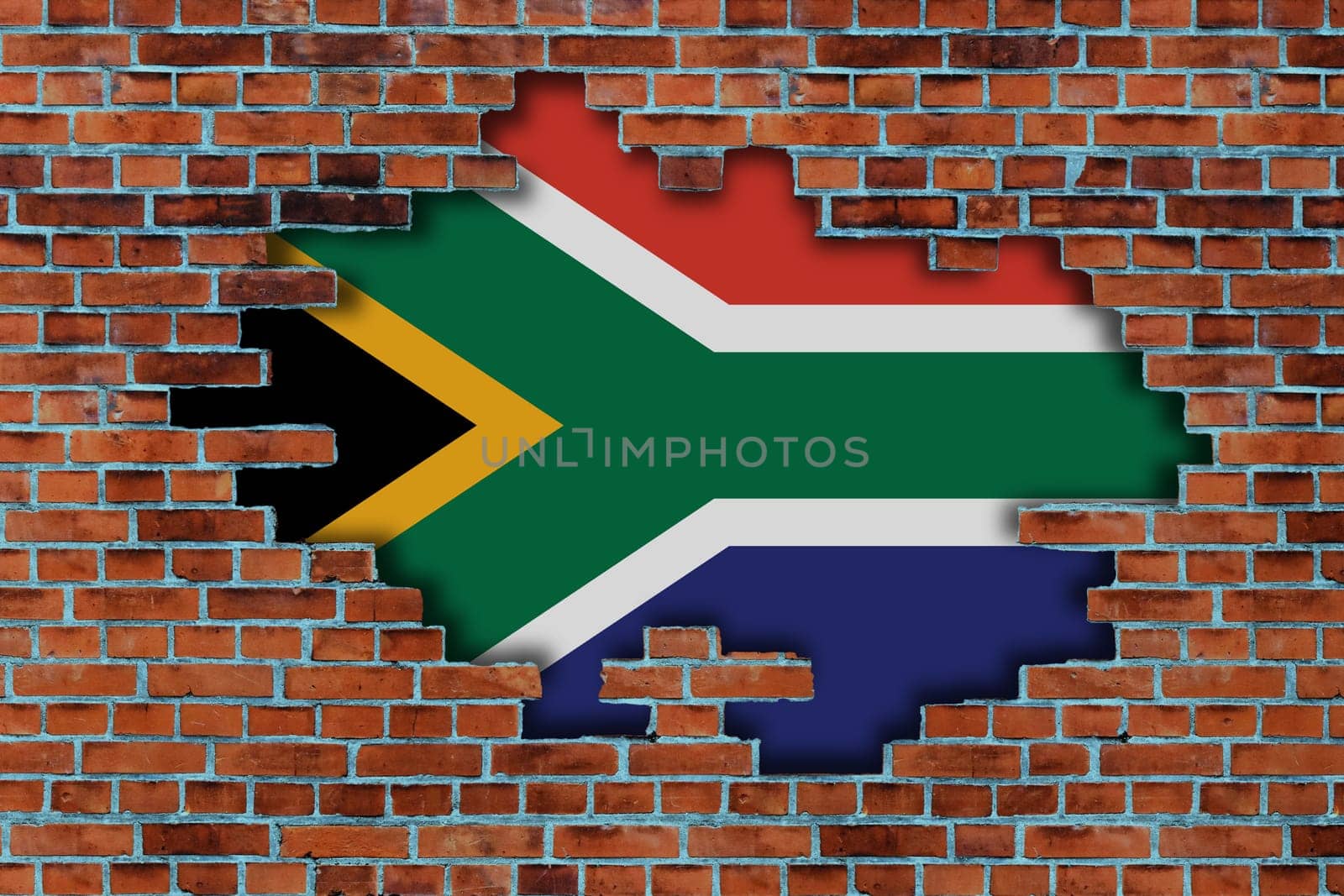 3D Flag of South Africa behind the broken old stone wall background.