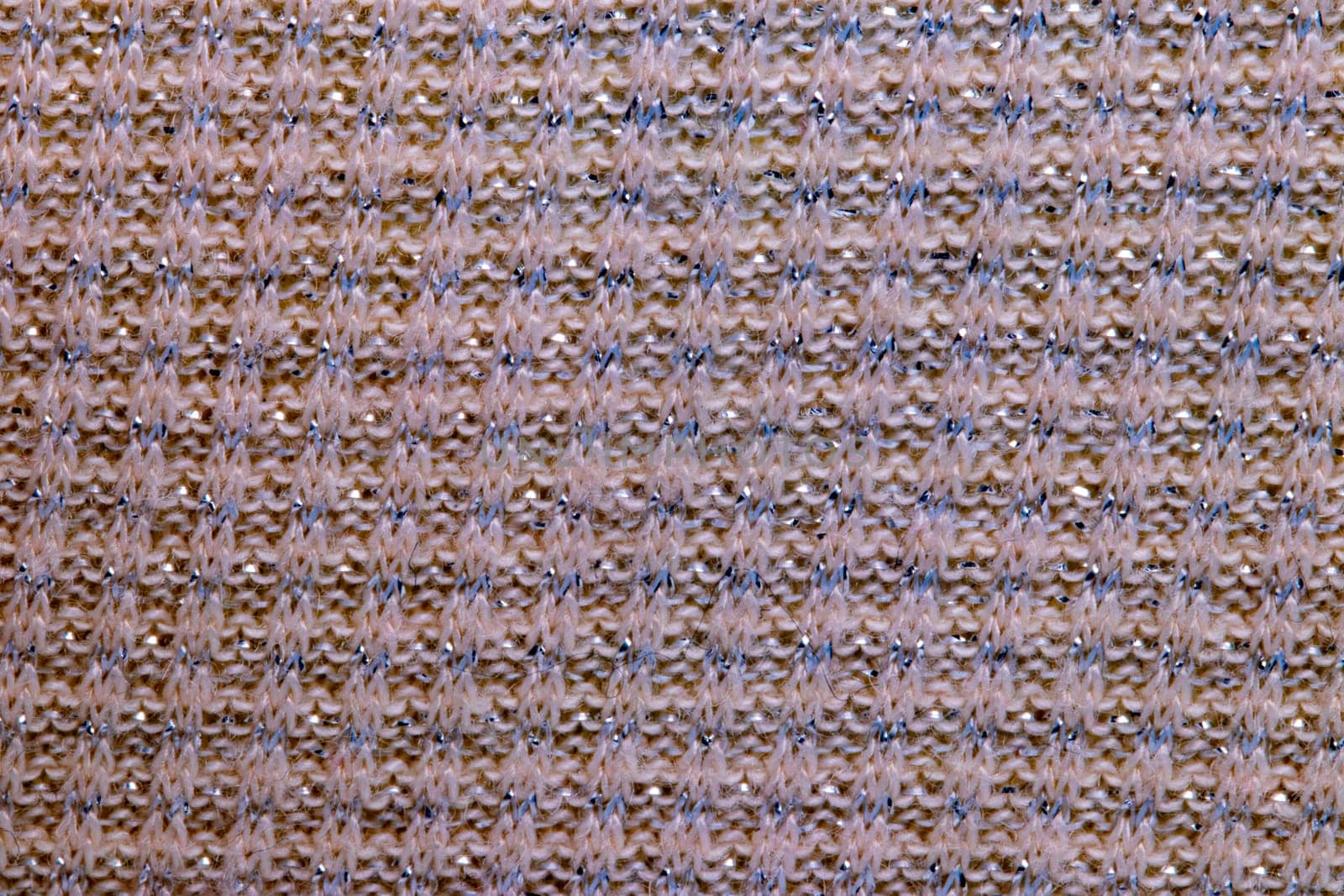 Pink fabric texture. Close-up of an elastic red nylon fabric with seamless pattern for sports equipment, backpacks, bags or other garments. Macro.