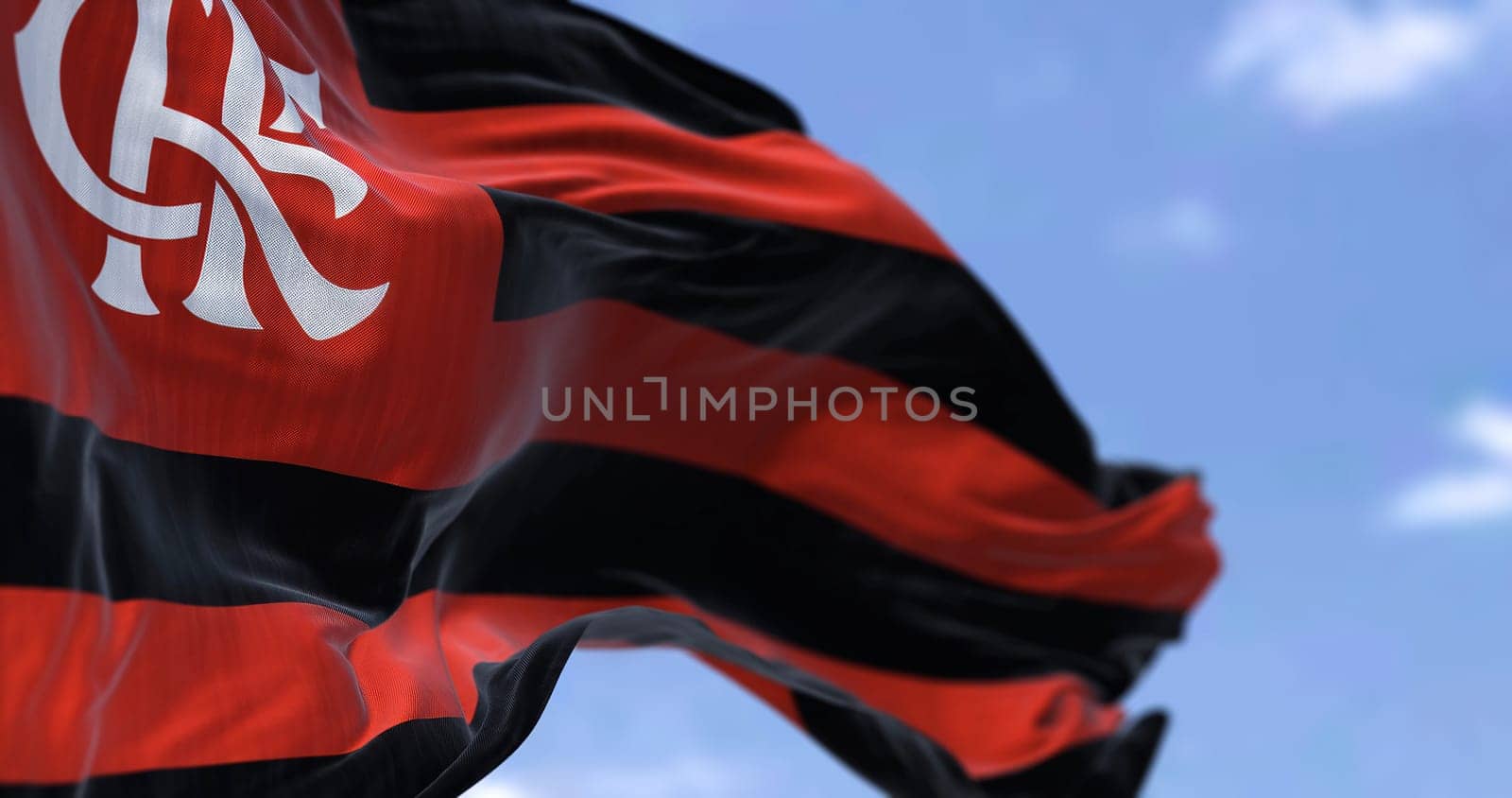Rio de Janeiro, BR, October 2022: Close-up view of the Flamengo flag waving in the wind. Flamengo is a Brazilian multi-sport club known mainly for the football section. Selective focus