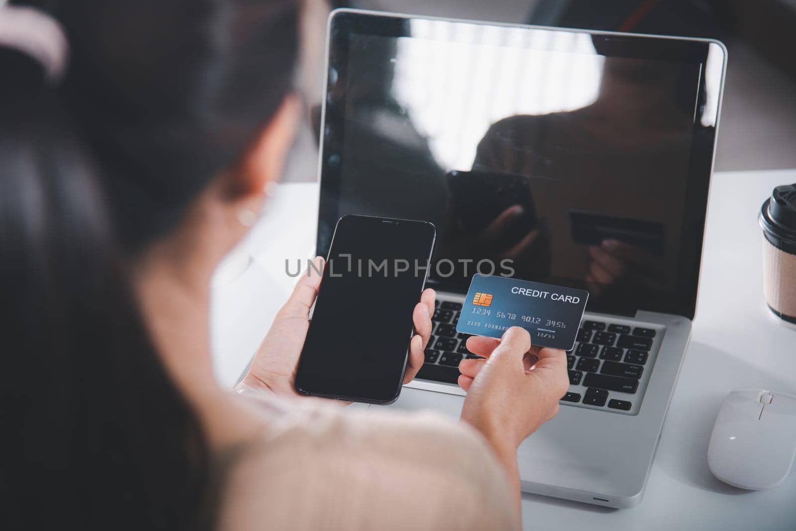 Female register via credit cards on mobile phone make digital payment security online, Business woman hands holding credit card and smartphone to pay product at home, Internet online shopping concept