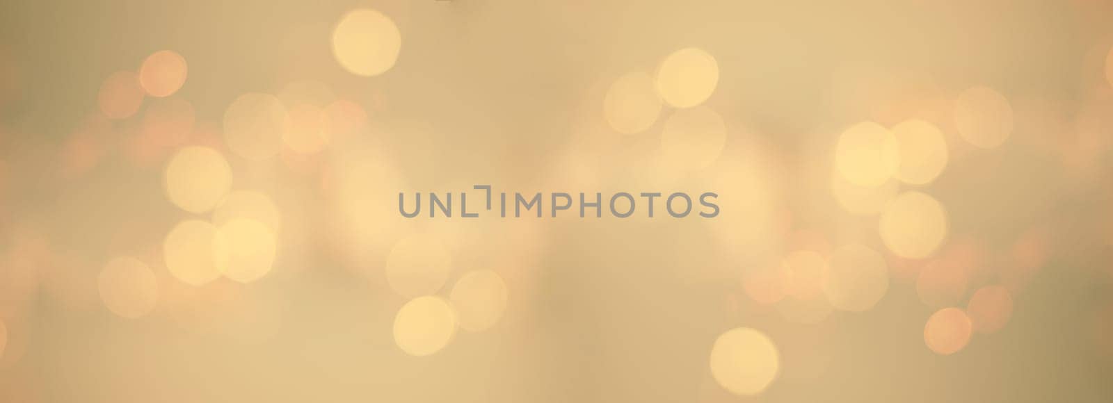 Bokeh background for christmas, defocused round lights in golden color, flare overlay