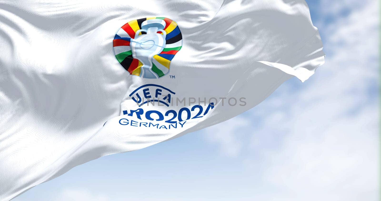 Berlin, Ger, October 2022: The flag of UEFA Euro 2024 flying in the wind. The 17th edition will take place from 14 June to 14 July 2024 in Germany. Selective focus. International sport event