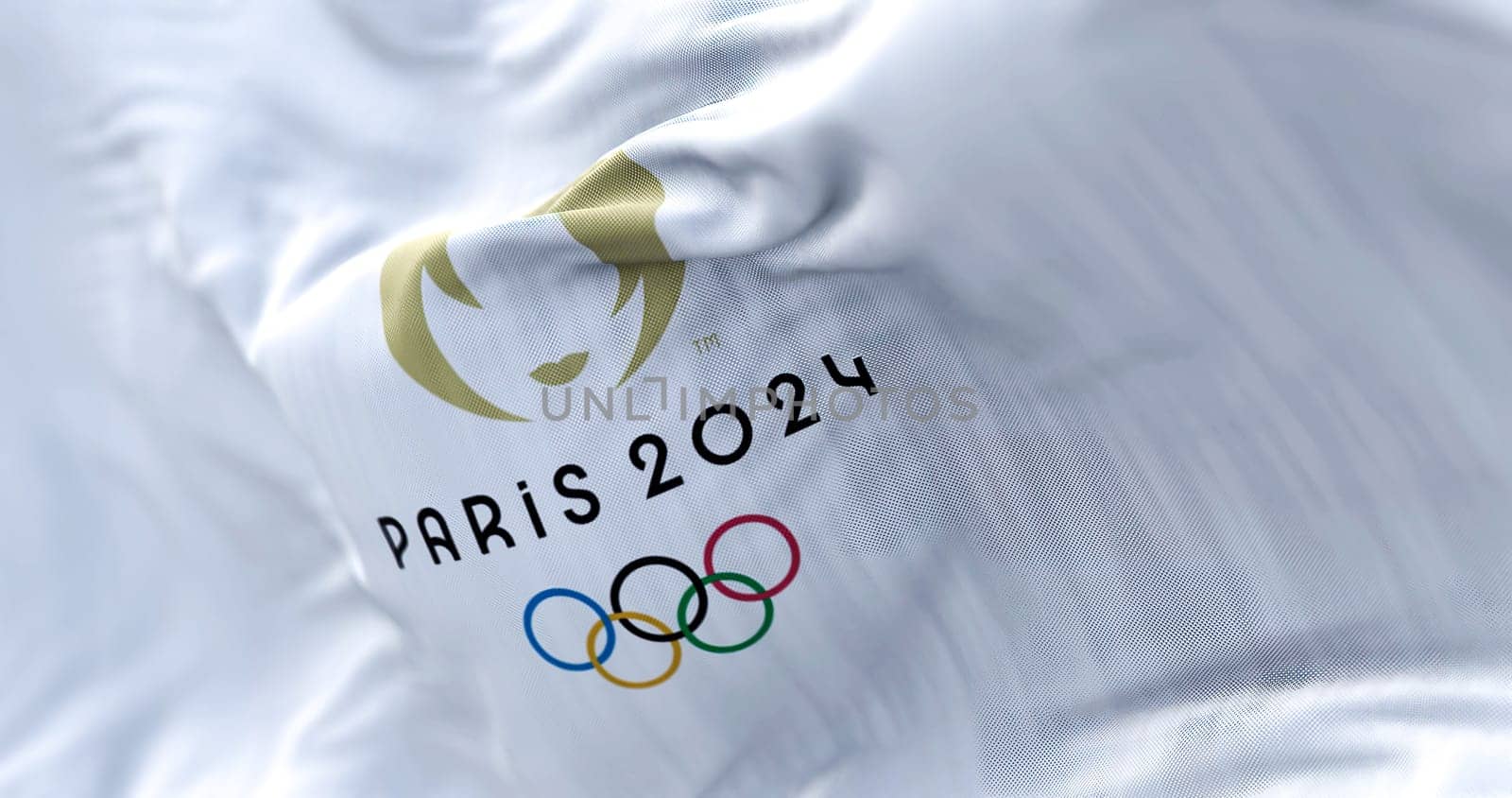 Paris, FR, October 2022: Close-up view of the Paris 2024 Summer Olympics flag waving in the wind. The XXXIII Olympic Games will be held in Paris, France, from 26 July to 11 August 2024.