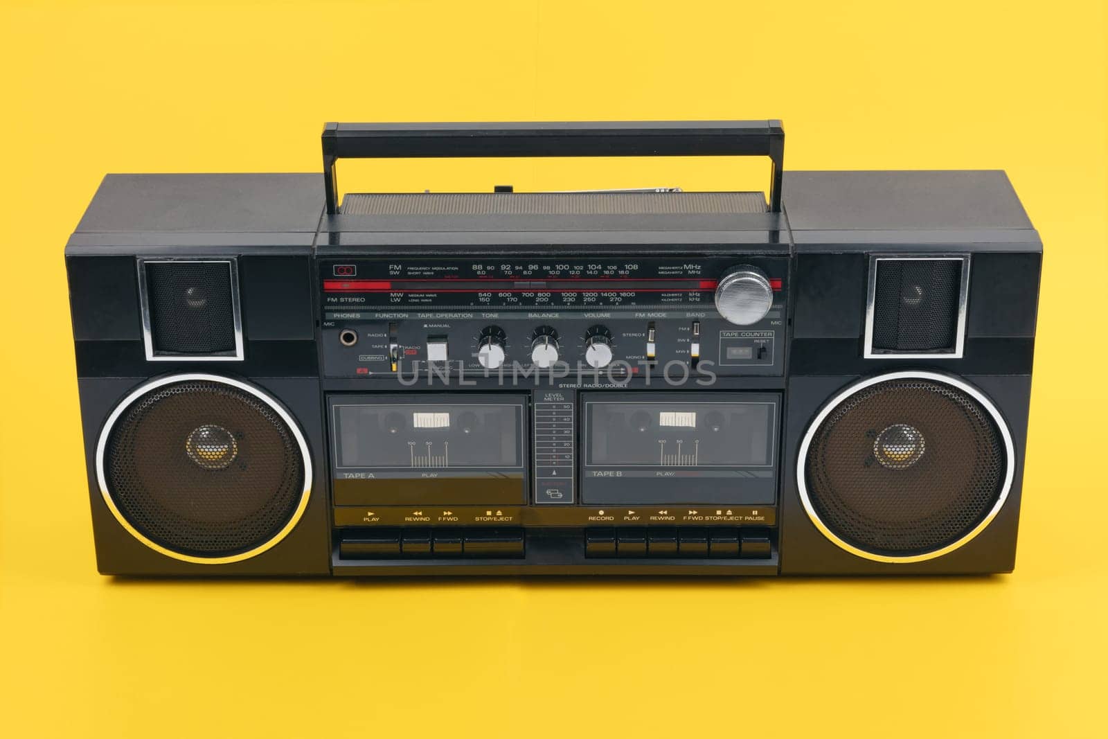Boom Box Tape Player isolated on yellow background