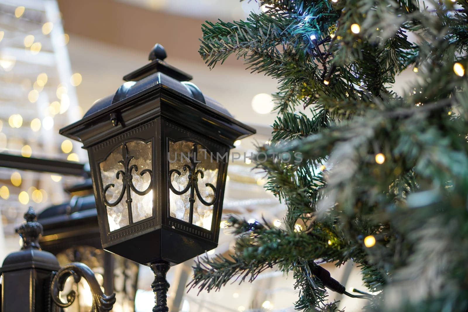 Street lamp decoration beside Christmas tree with led