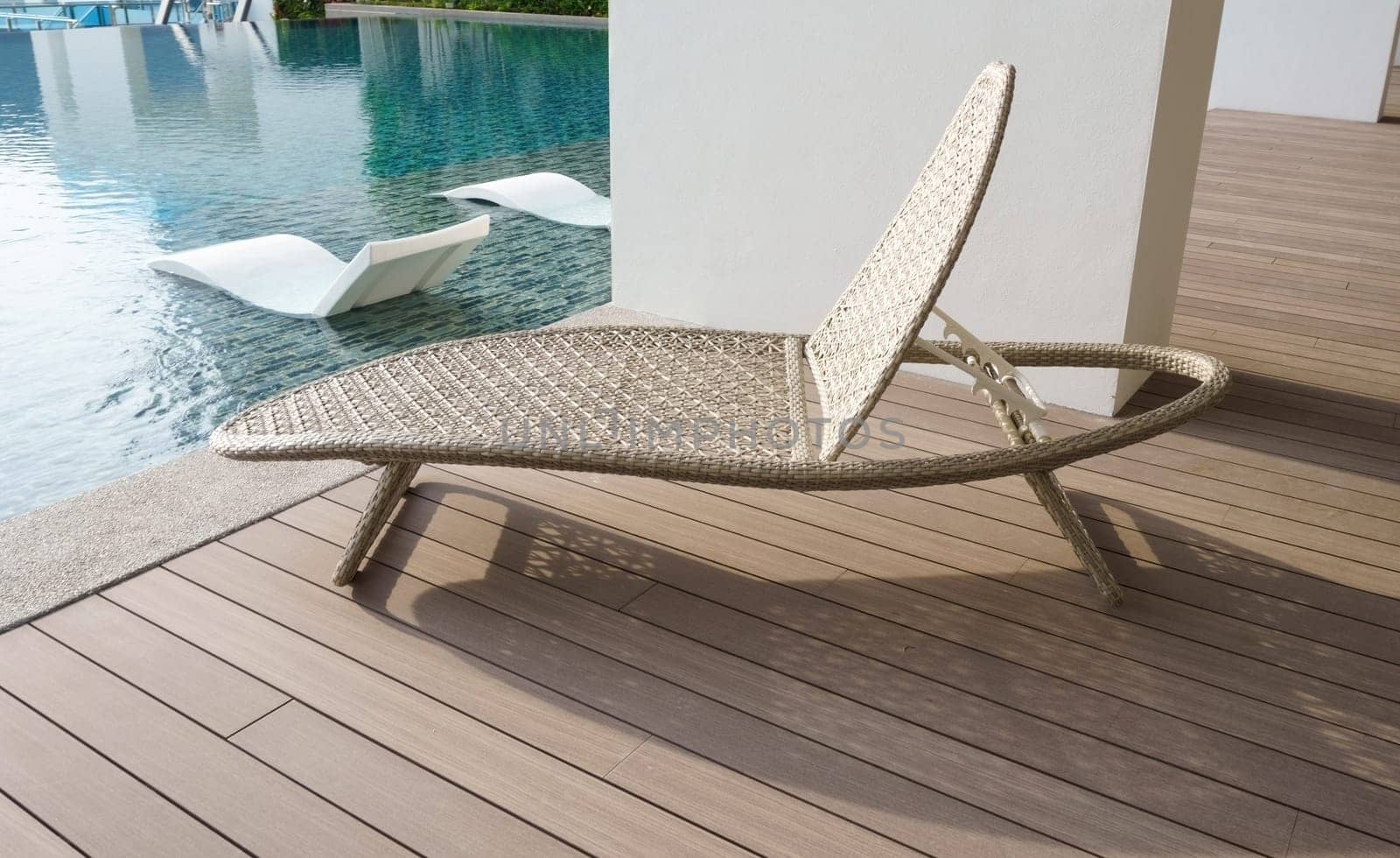 Outdoor leisure lying bed beside swimming pool