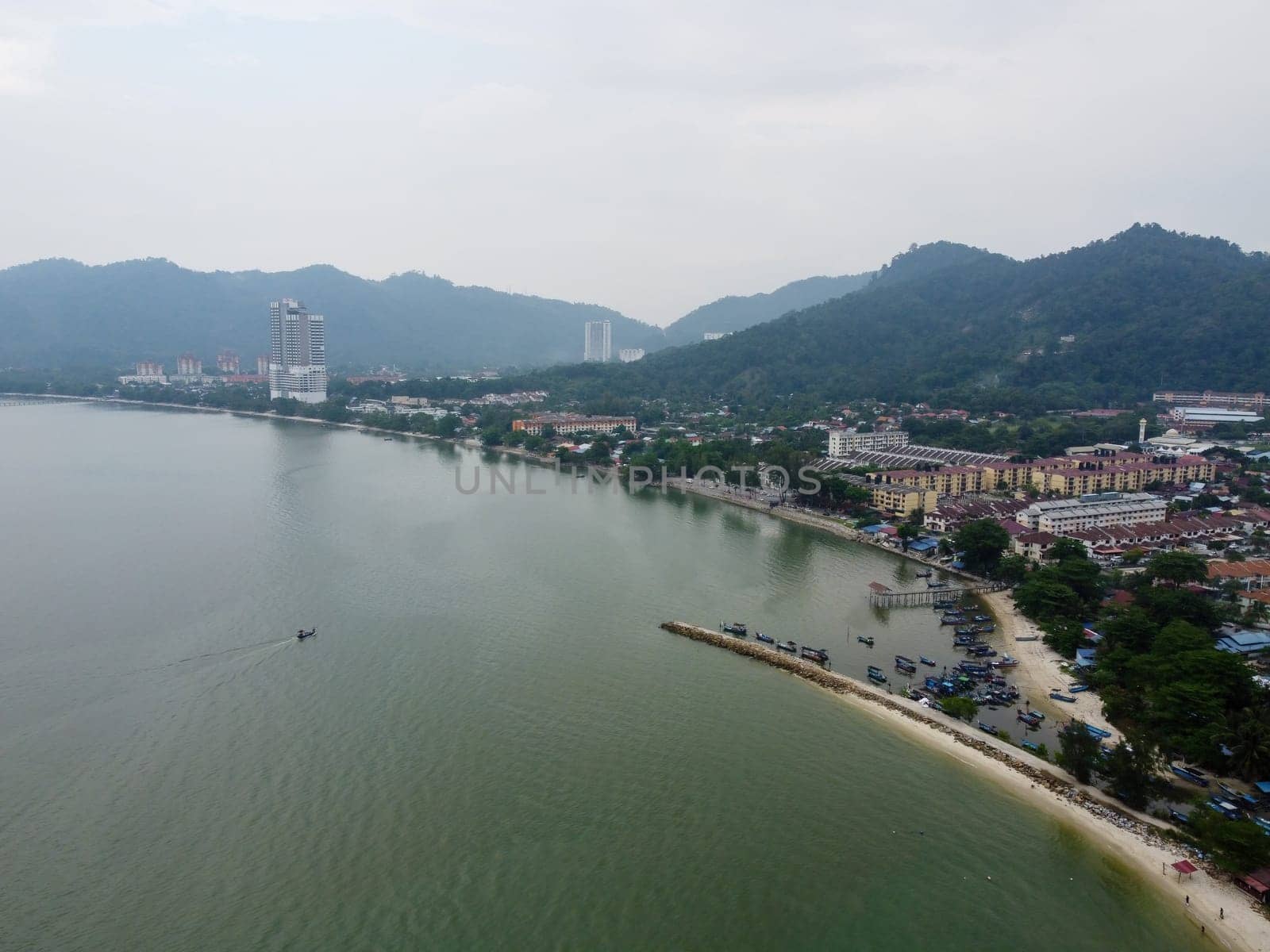 Aerial view fishing boat back to village