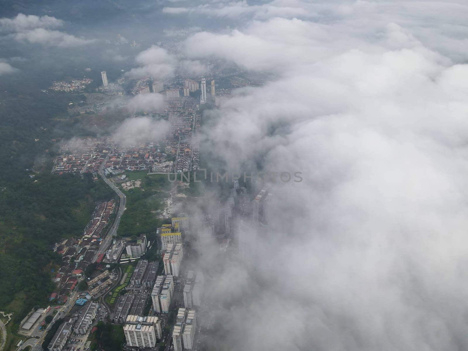 Morning low cloud over apartment and condominium at Paya Terubong.