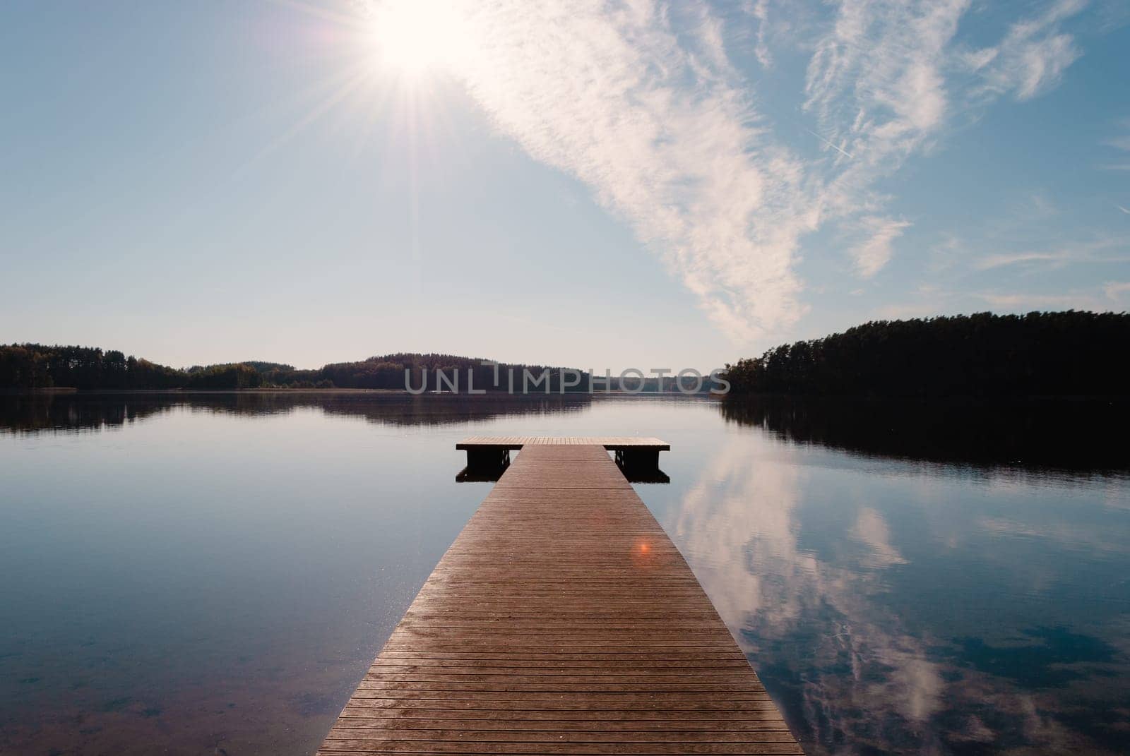 Wooden pier on Lake Baltieji Lakajai in Labanoras Regional Park, Lithuania.
