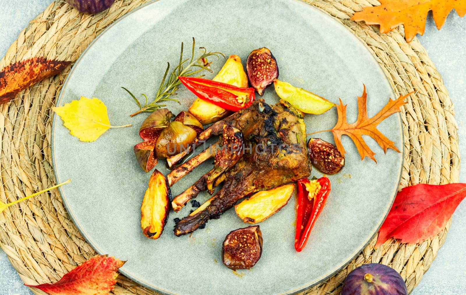 Lamb meat on the ribs, roasted with figs. Grilled lamb ribs