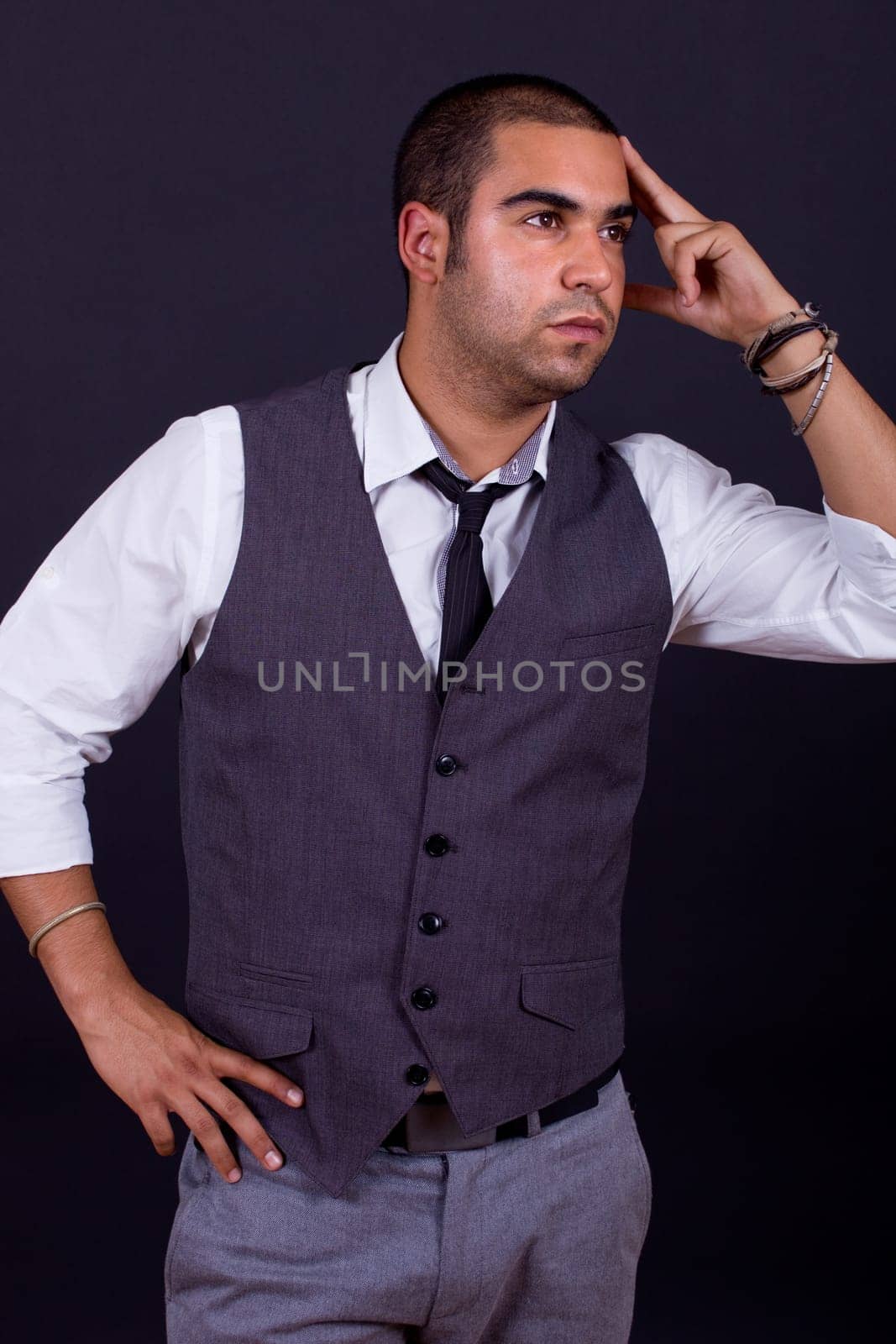 pensive business man portrait on black background