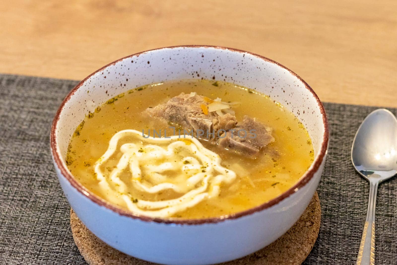 Close up shot of the of the mud bowl with the soup