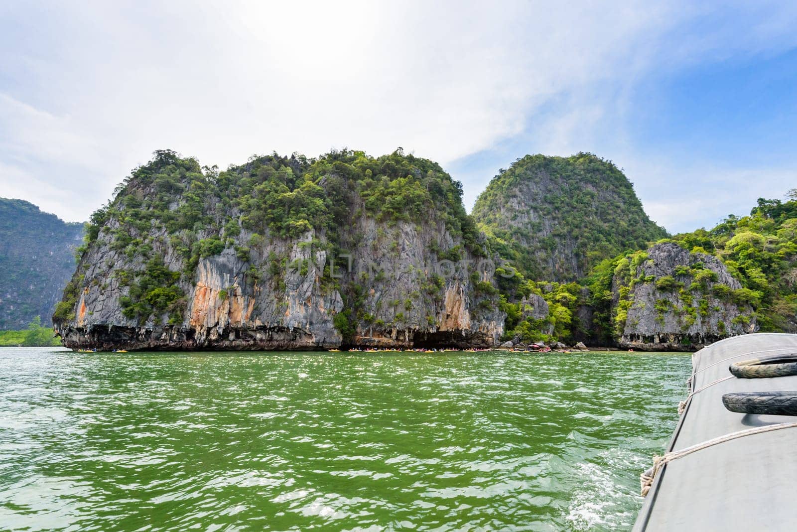 Beautiful landscape of island sea and sky in summer as tourists are happy with the canoeing at Tham Lod cave in Ao Phang Nga Bay National Park, Thailand