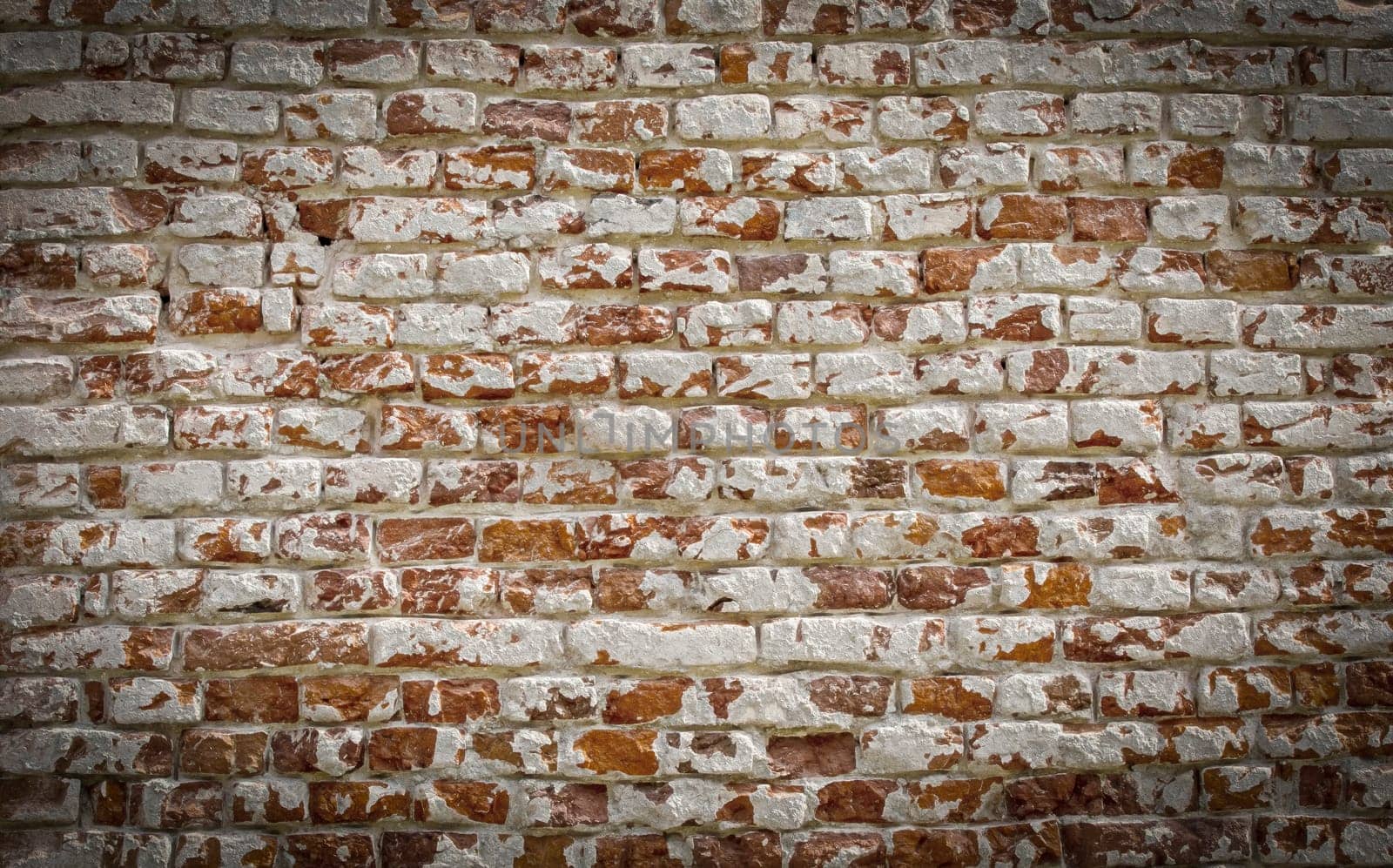 The Old brick wall with white paint background texture close up