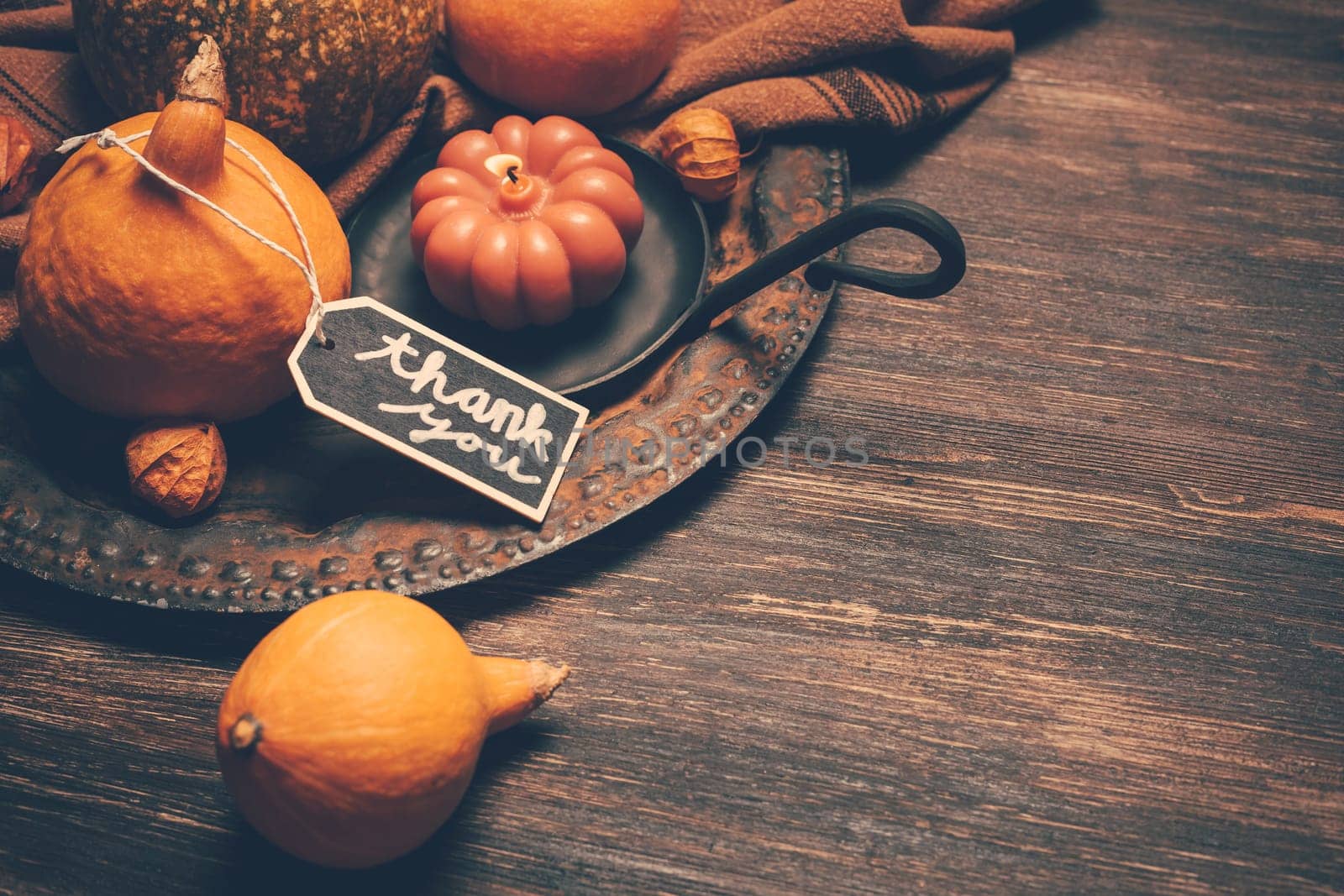 Happy Thanksgiving Day background, wooden table decorated with Pumpkins and Candles