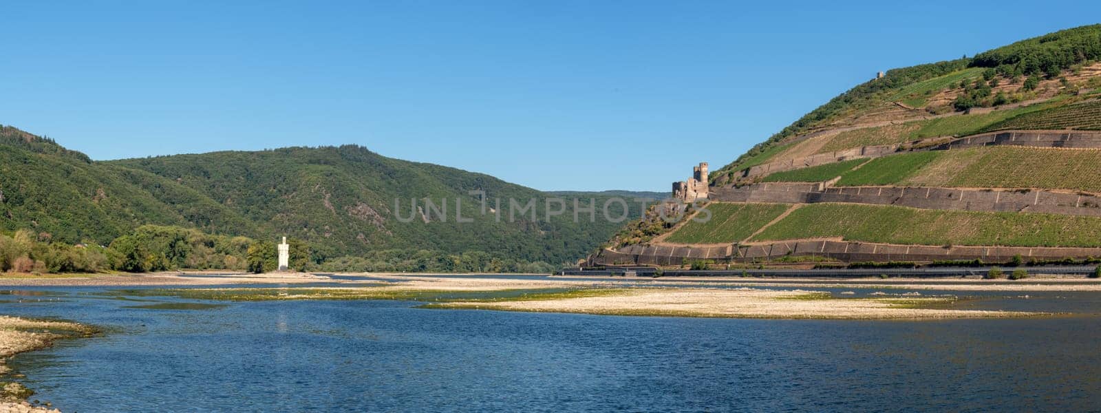 BINGEN, GERMANY - AUGUST 13, 2022: Drought in Germany, low water on Rhine river on August 13, 2022 in Bingen, Germany
