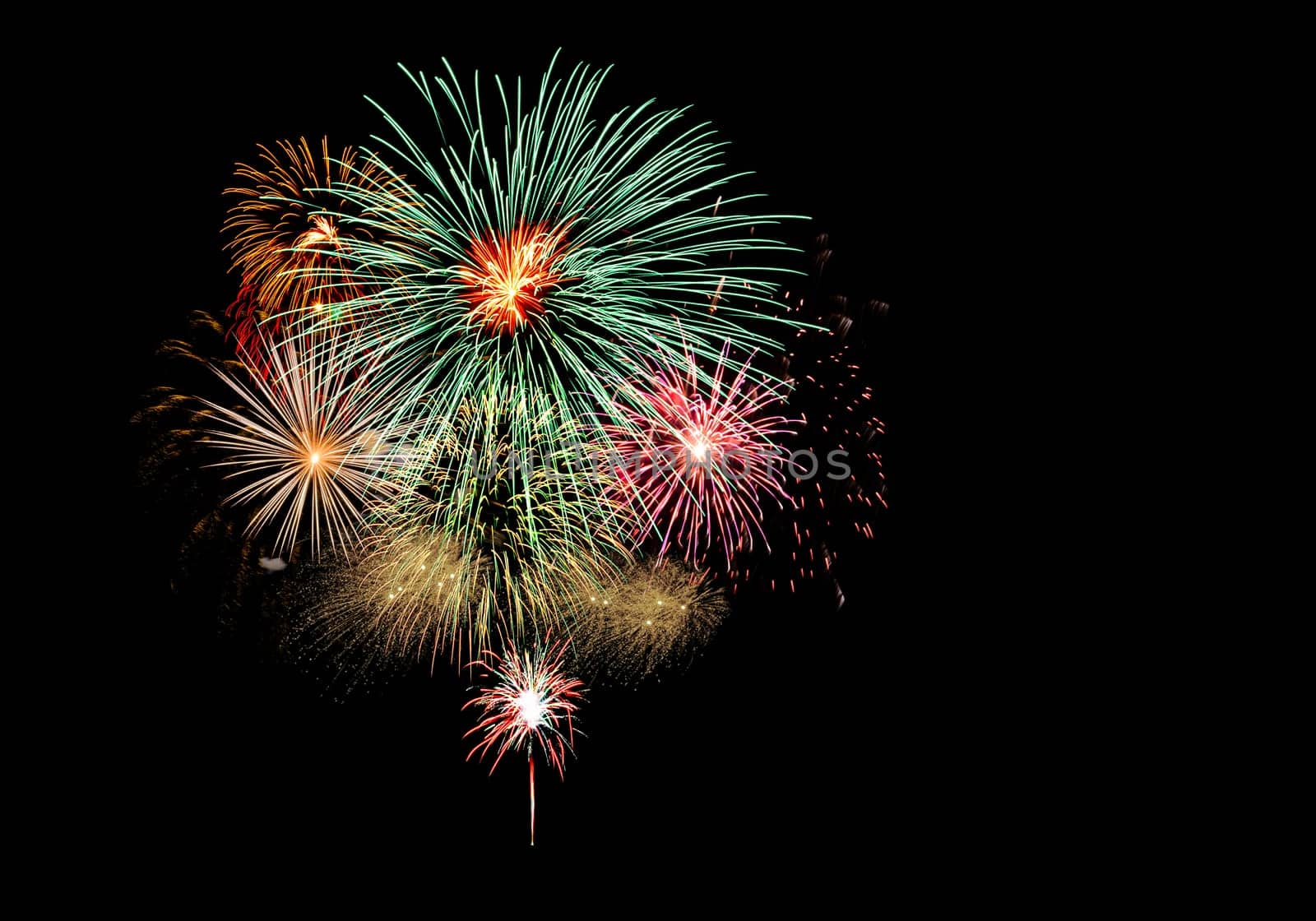 Fireworks light up the black sky with dazzling fireworks exploding display
