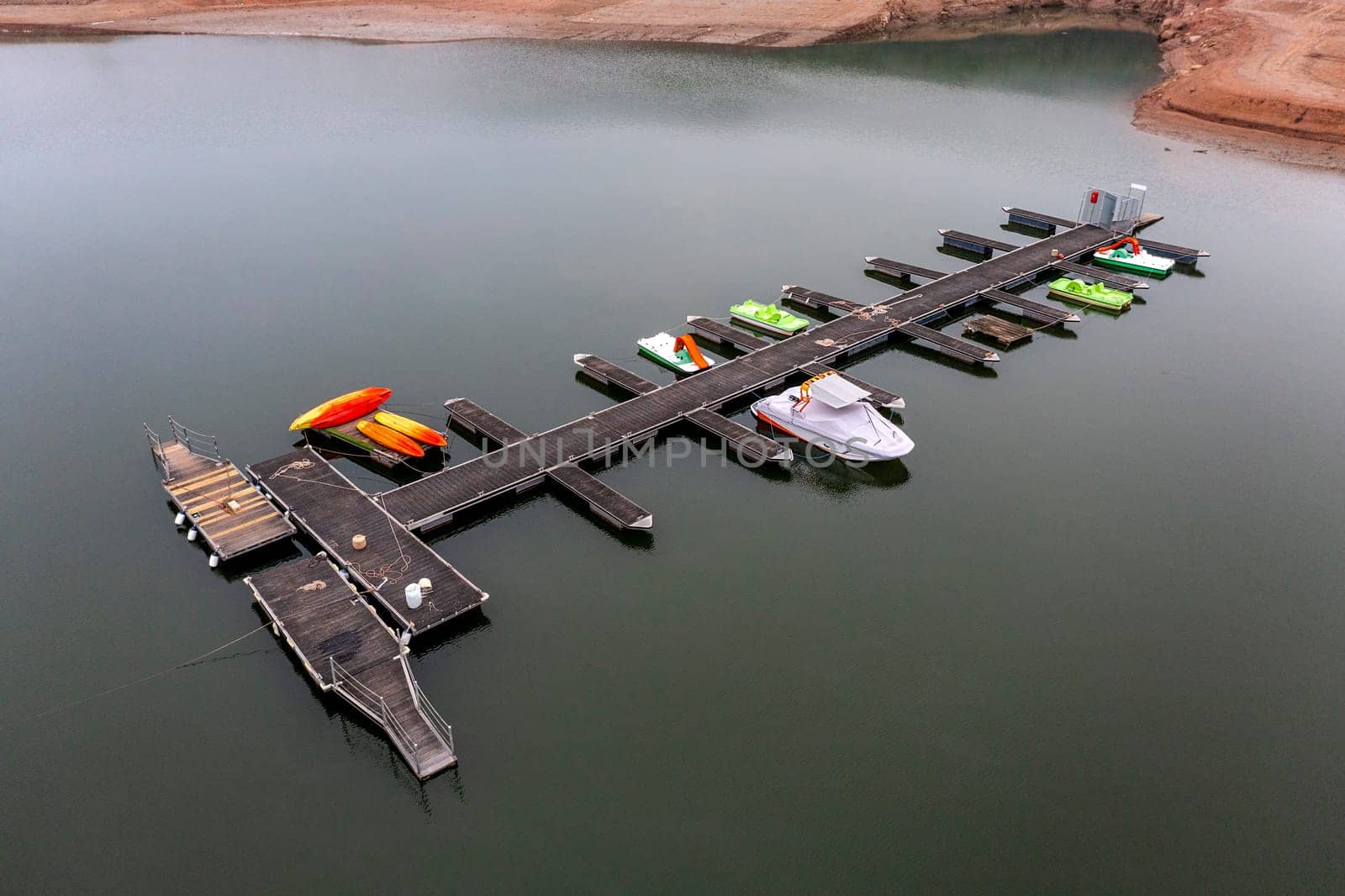 Aerial view of Sau Reservoir, in the Ter River, in the Province of Girona, Catalonia, Spain. After months without rain the level of the swamp is very low. jetty detail