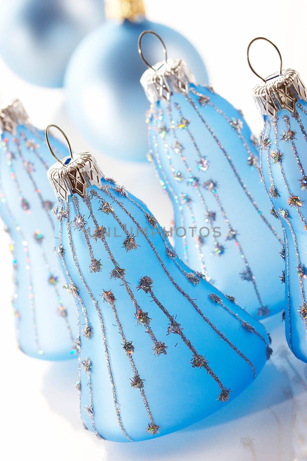 Christmas decoration: some xmas blue bells over white background