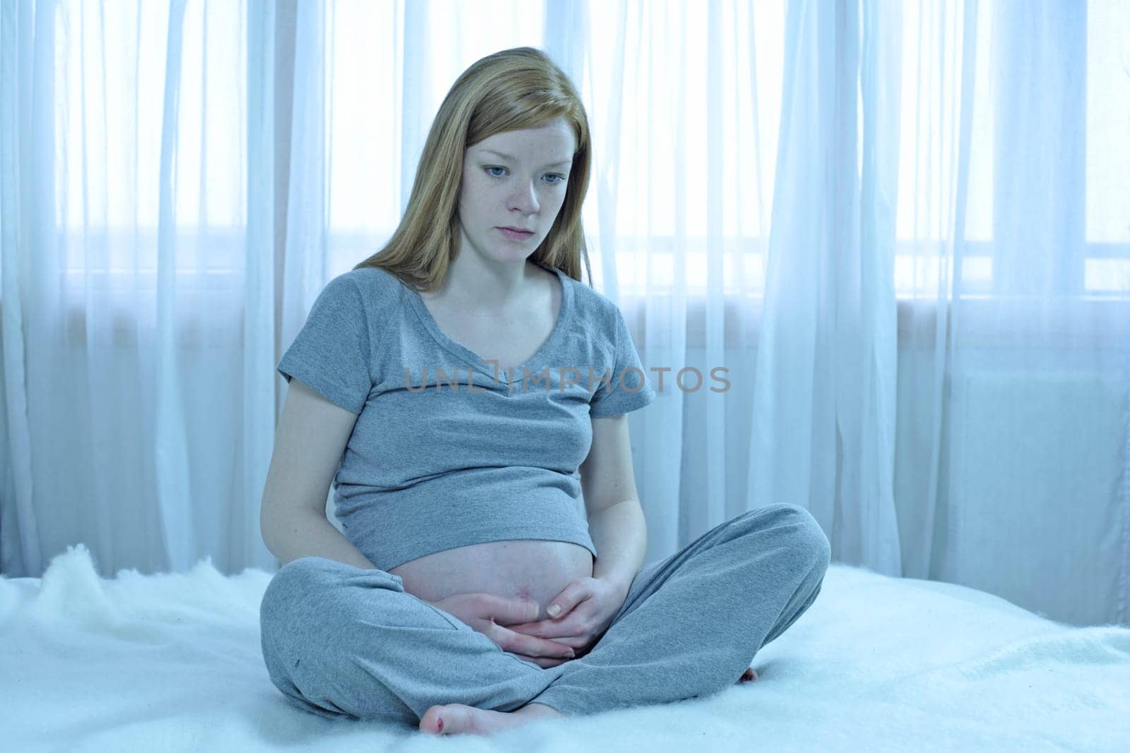 pregnant girl looking very worried