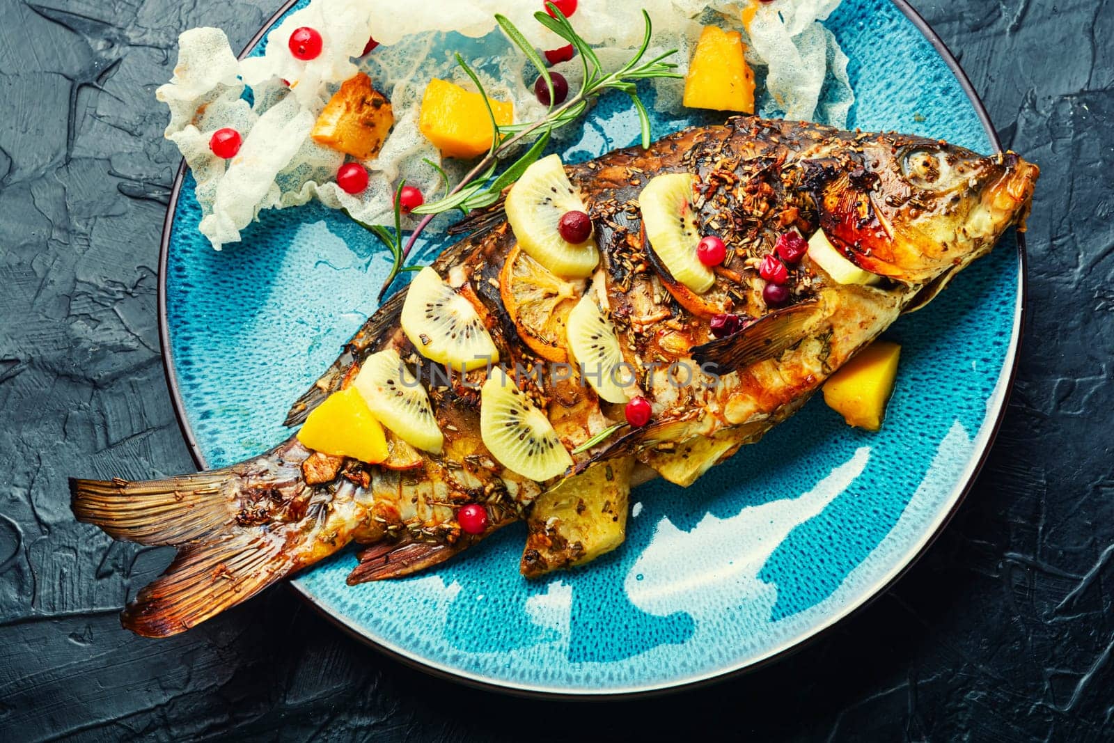 Baked whole fish dorado in fruit marinade,fish dish