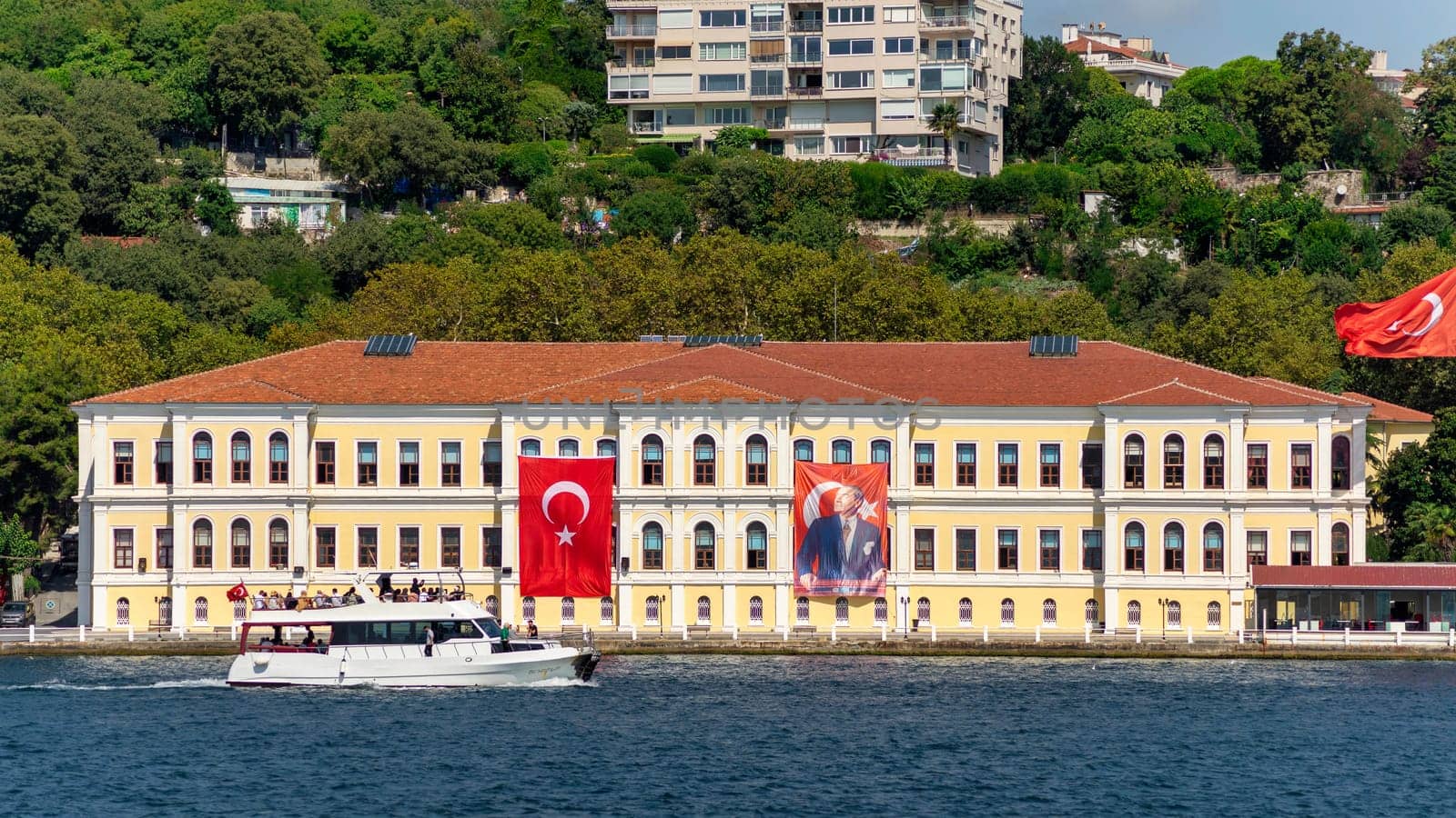 Morning view in a sunny day of Kabatas Erkek Lisesi building, or Kabatas High School, suited by Bosphorus Strait in Ortakoy, Besiktas, Istanbul, Turkey