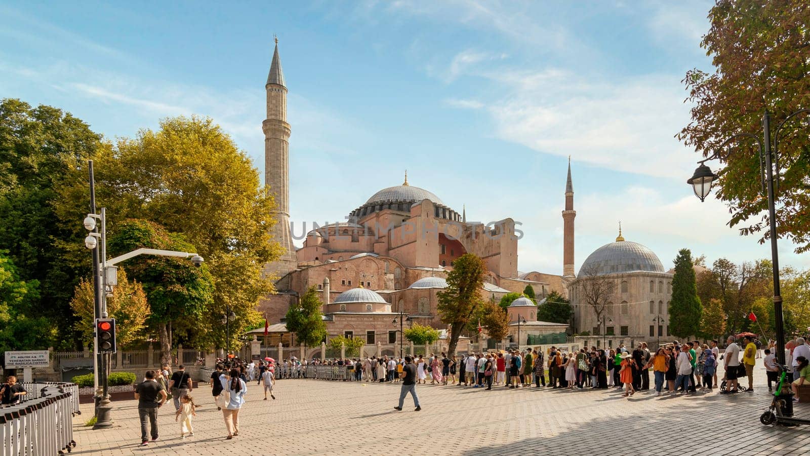 Istanbul, Turkey - August 30 2022: Long queue of tourists and locals waiting to enter Hagia Sophia Mosque, or Ayasofya Camii, formerly a Greek Orthodox church, during Victory Day holiday