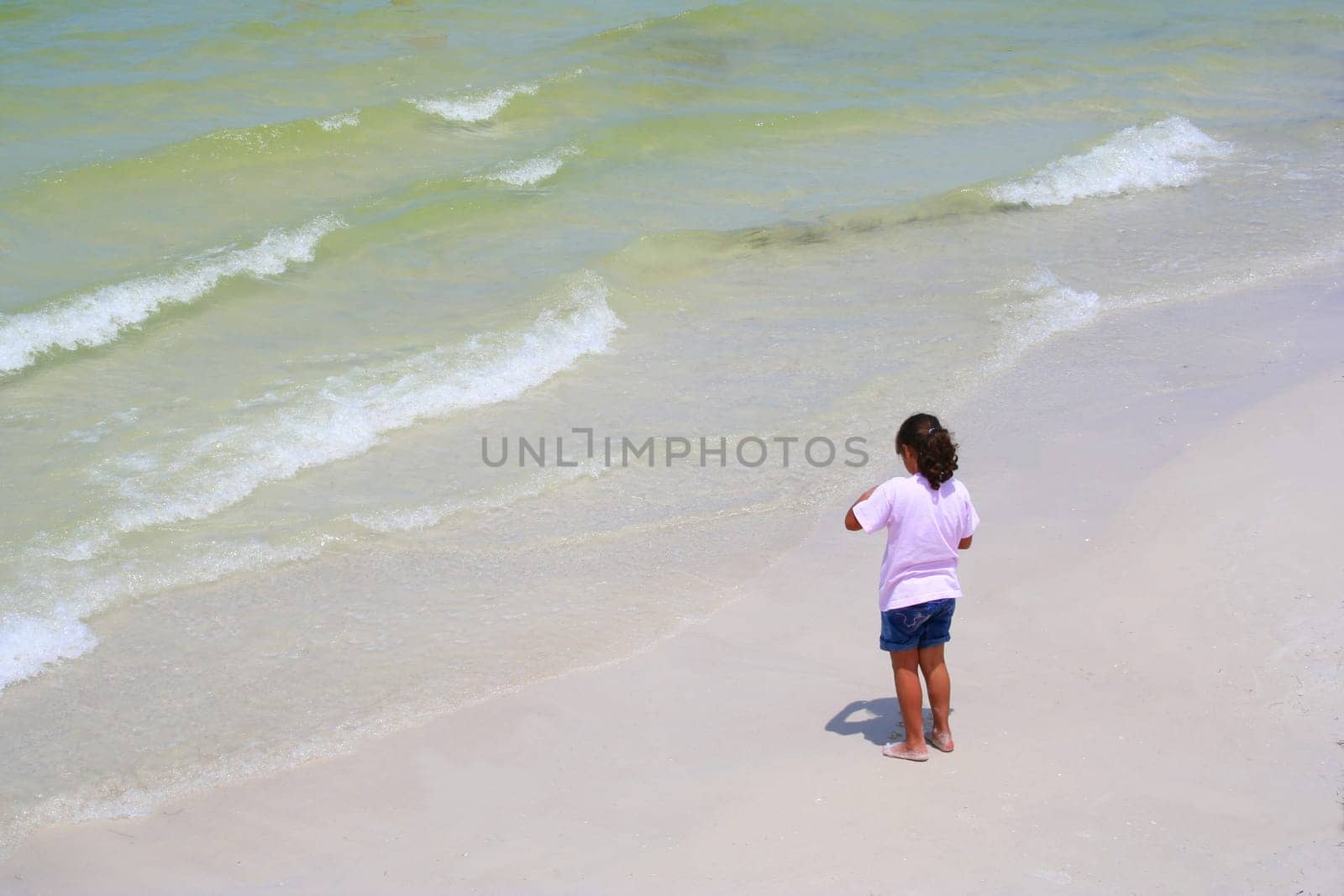 Girl by the water in summer time