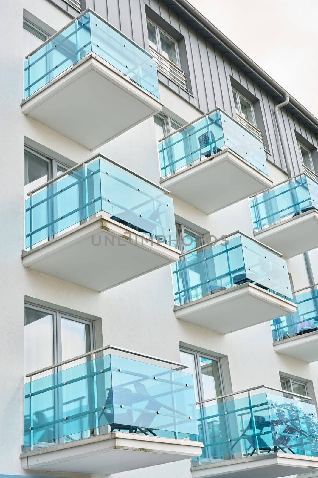 Facade of a house with blue balconies in the center of Swinoujscie in Poland