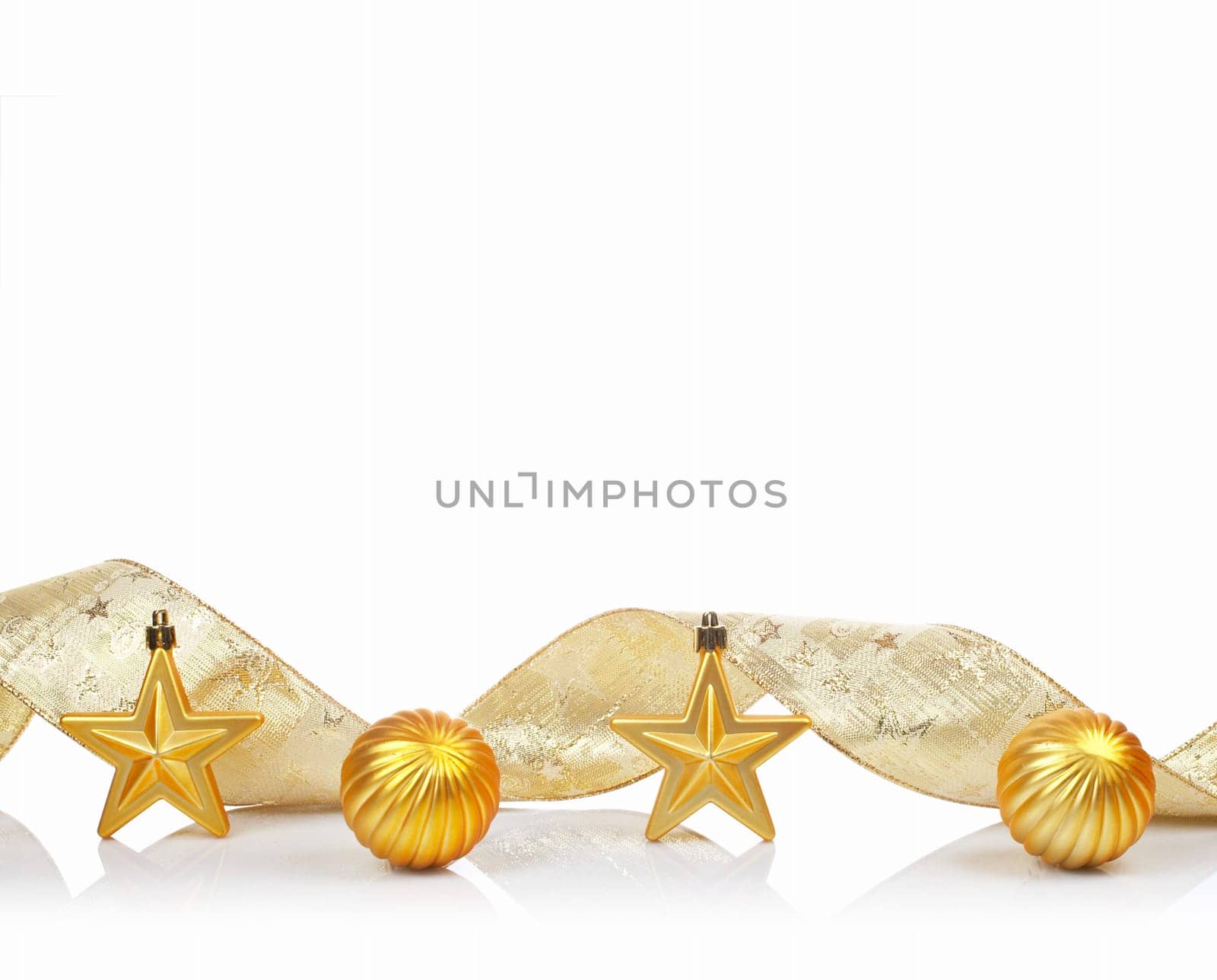 A golden Christmas ornaments, reflected on white background with space for text