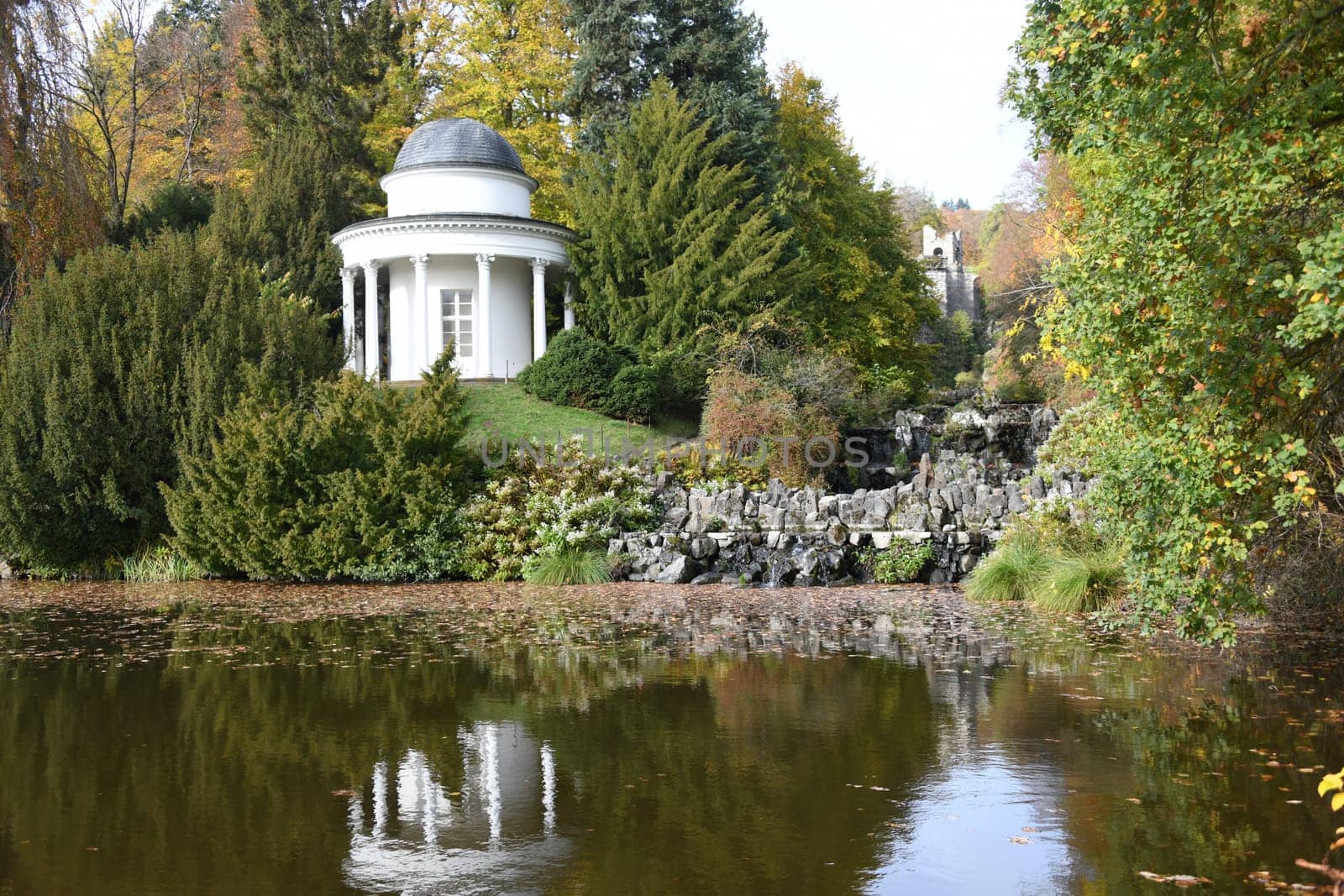 The Jussow Temple built in 1818 in the Bergpark Wilhelmshöhe in the city of Kassel in Hesse with an open colonnade stands at the fountain pond at the end of the Peneu cascades.