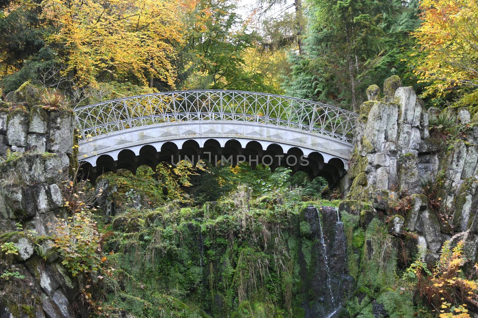 The devils bridge in the Bergpark Wilhelmshöhe in the city of Kassel in Hesse spans the Höllenteich. In 1826 the lattices of the bridge were cast from solid metal. A popular destination