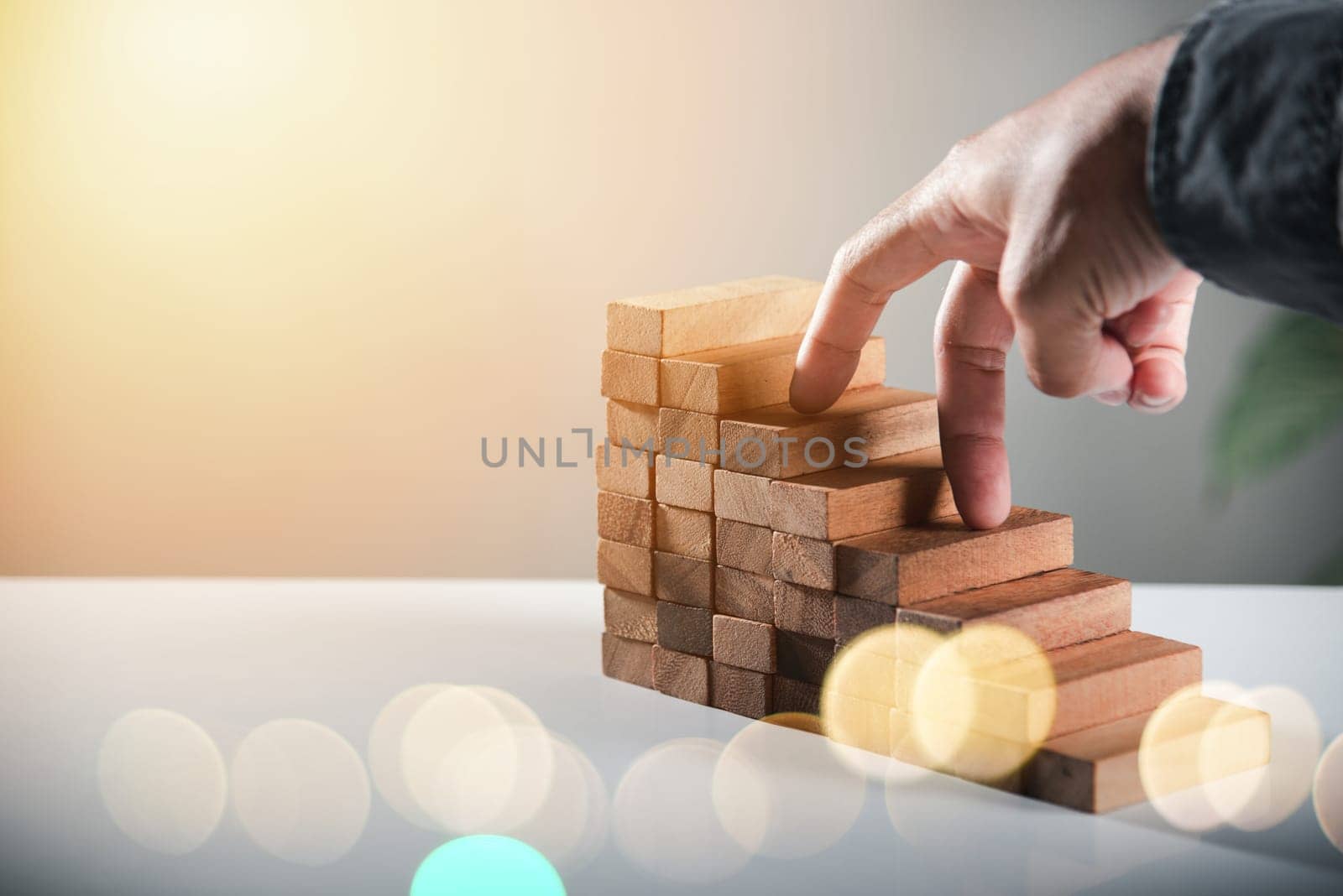 Business two finger symbol walking up on wood blocks shape staircase to climb up career ladder step up stair growth success, prevent collapse or crash concept