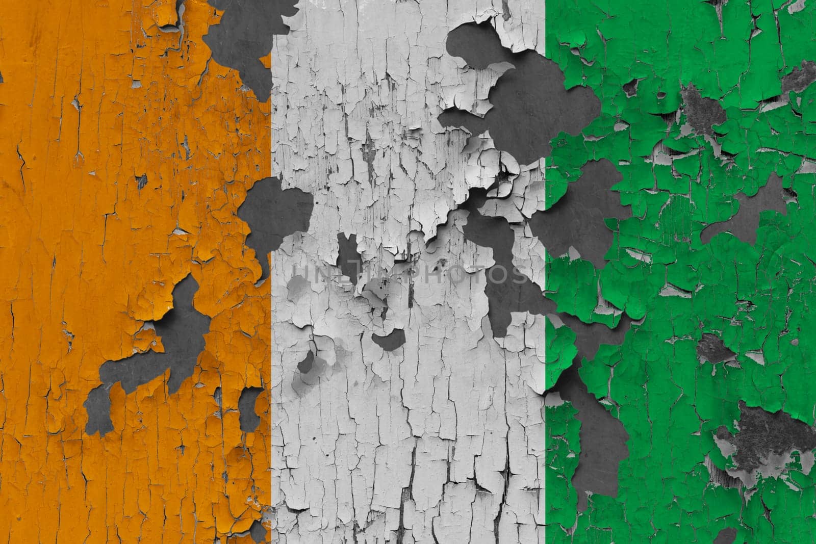 3D Flag of Ivory Coast on an old stone wall background.