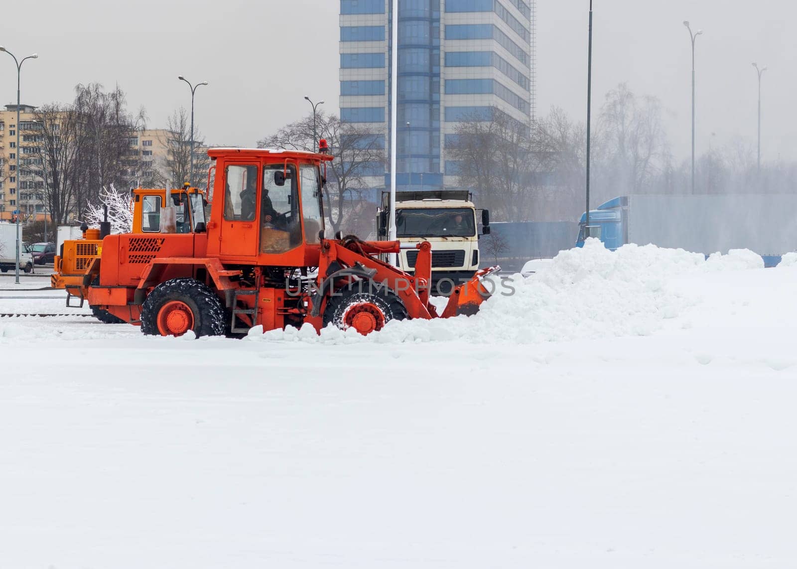 Heavy machinery cleaning the snow after heavy snowfall