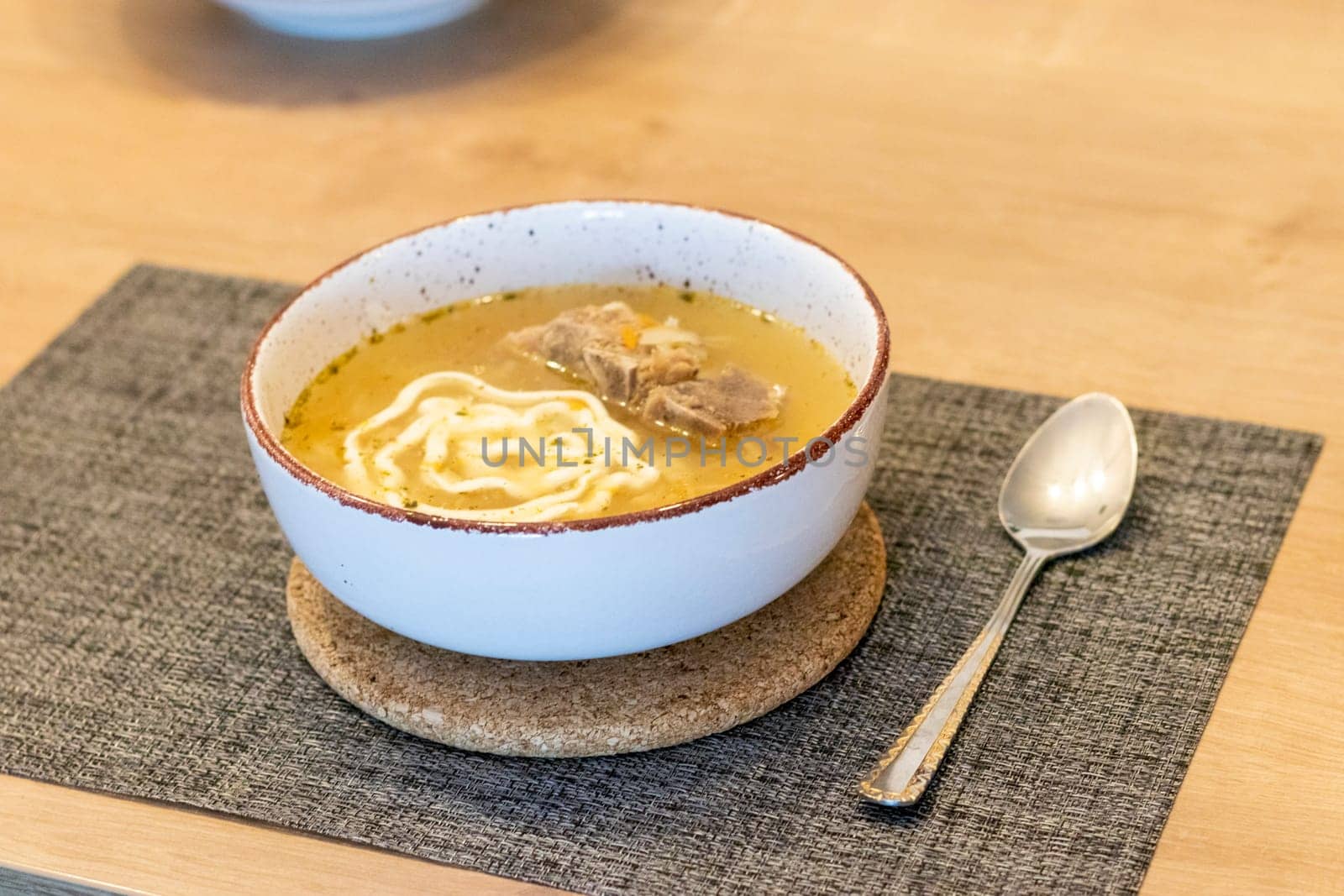 Close up shot of the of the mud bowl with the soup