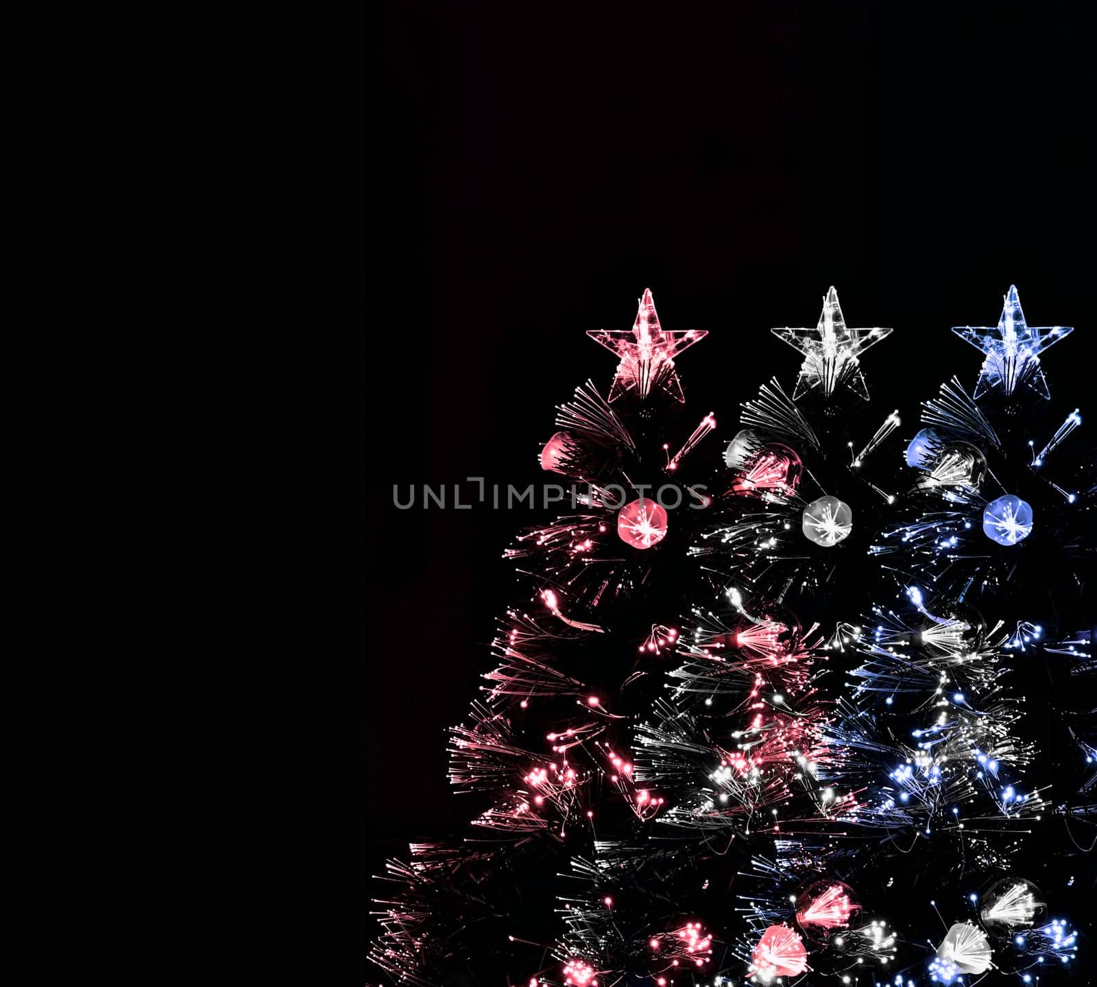 Red, white and blue Christmas Trees on black background