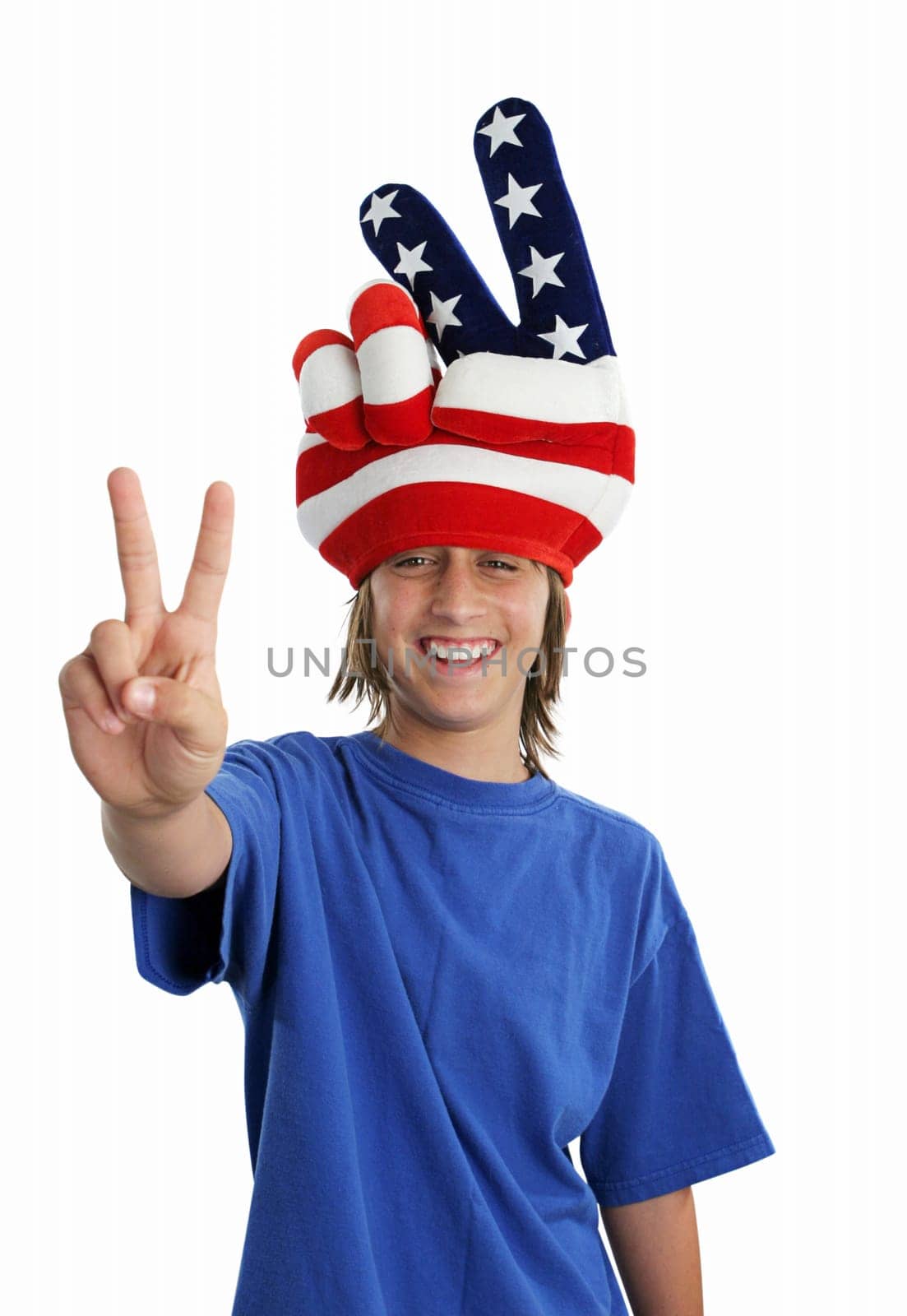 A patriotic teenager wearing a USA hat and giving a peace sign.
