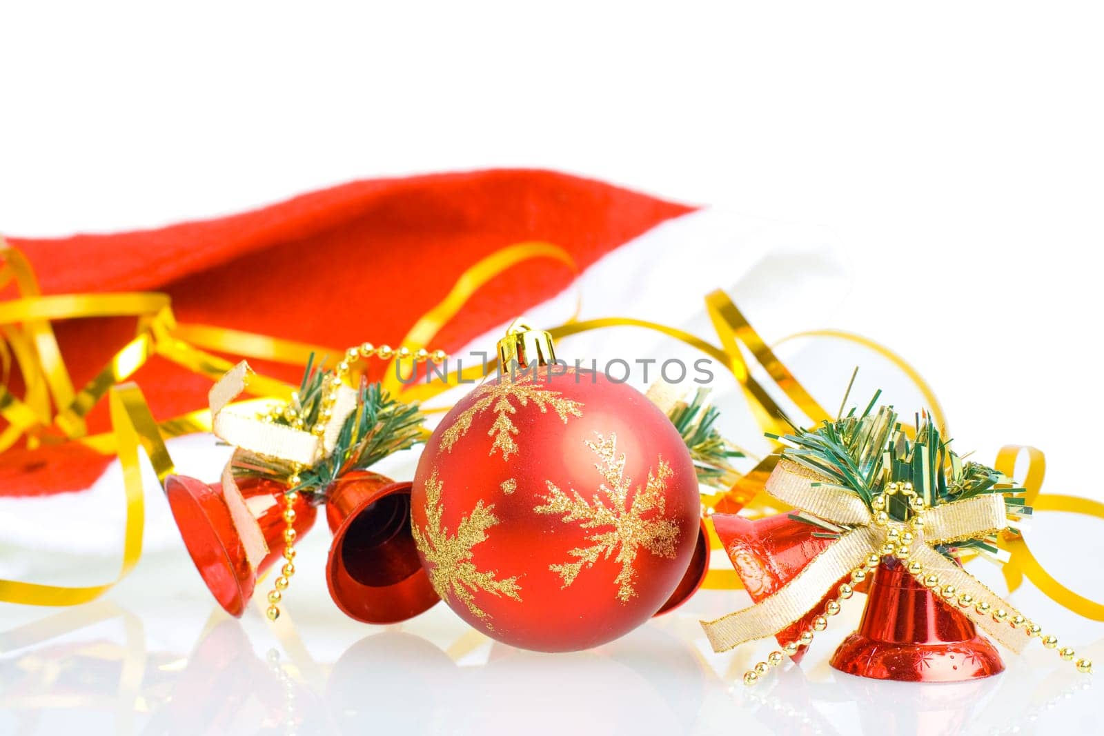 Red Christmas balls and hand bells isolated on white background