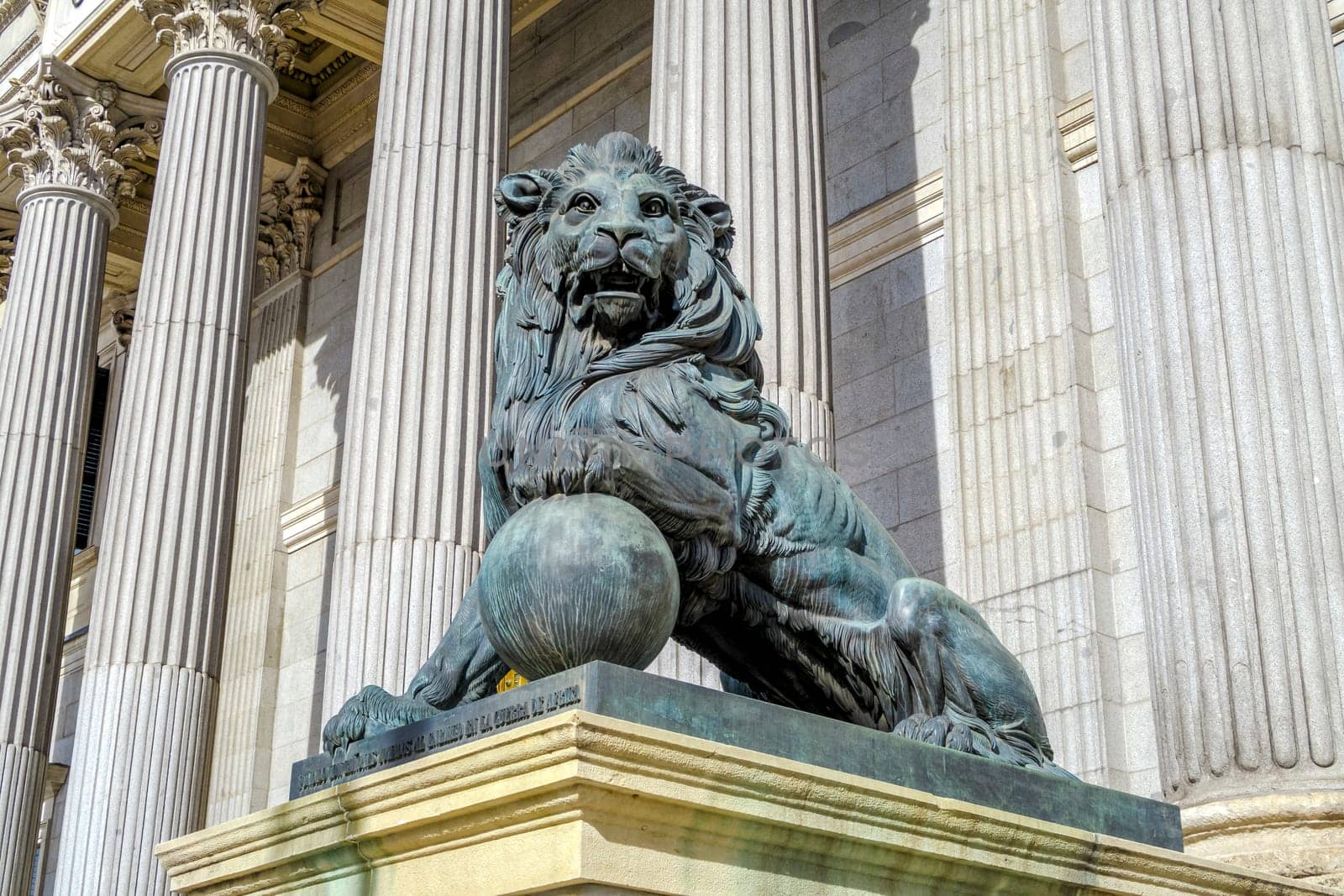 Lion statue entrance to Congress of the Deputies Madrid Spain government building