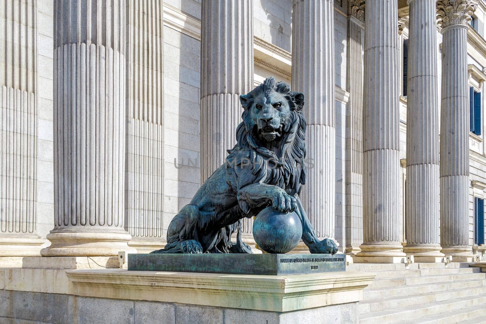 Lion statue entrance to Congress of the Deputies Madrid Spain government building