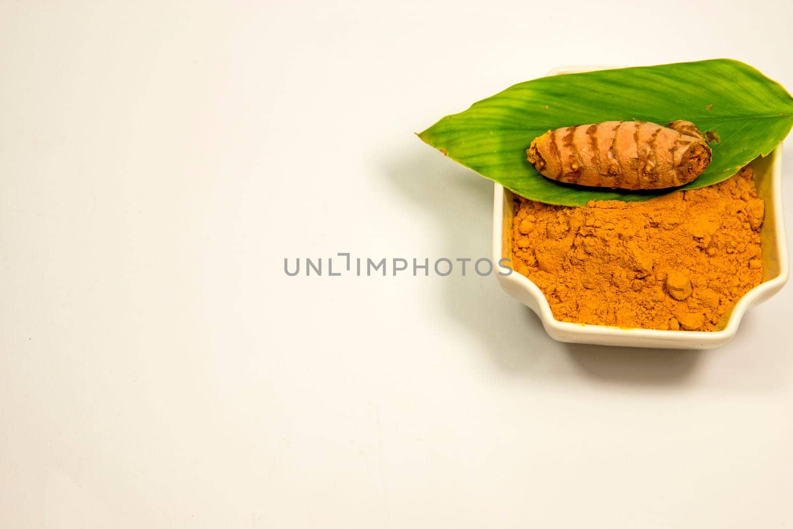 turmeric, roots and powder in a closeup