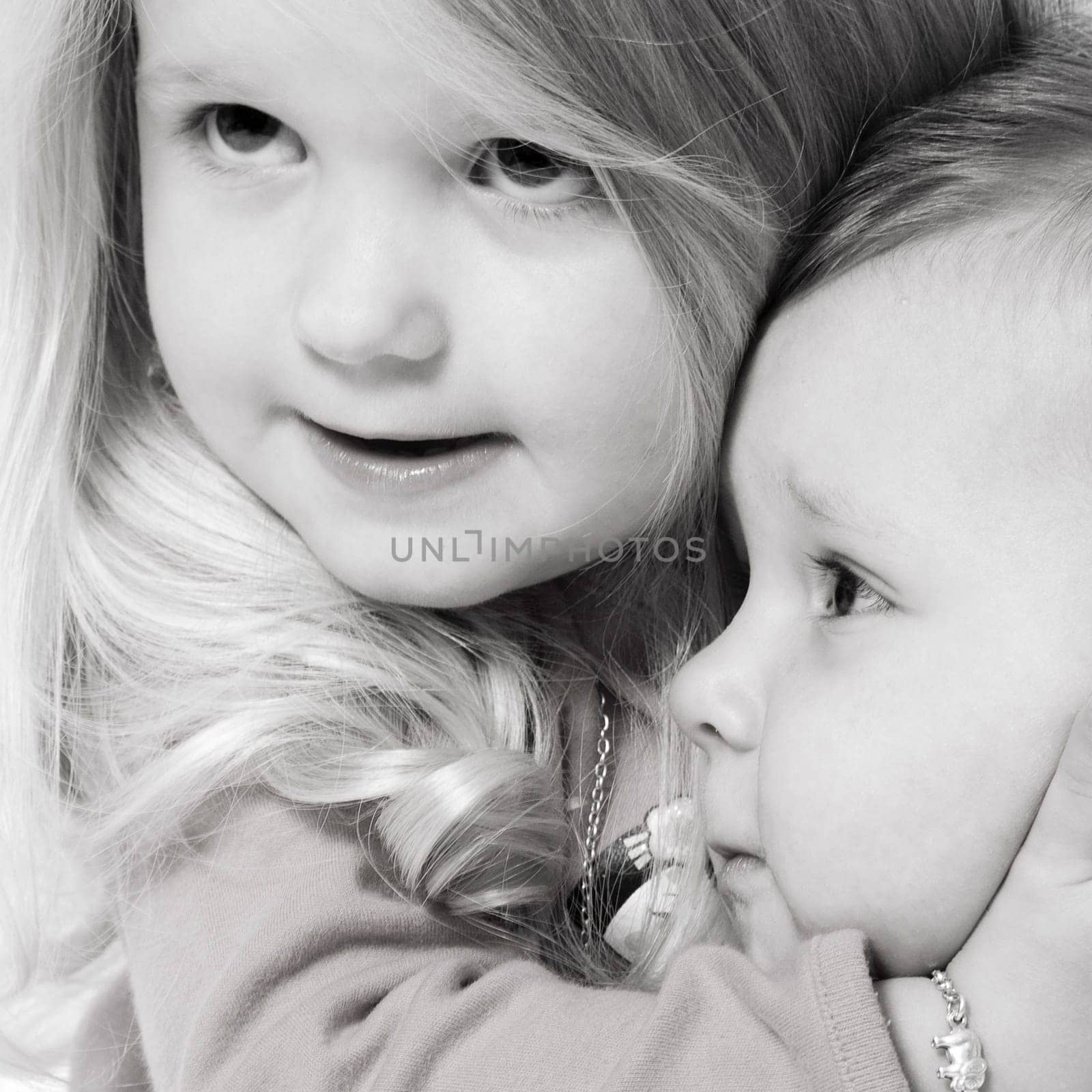 little children portraits taken in the studio on a white background