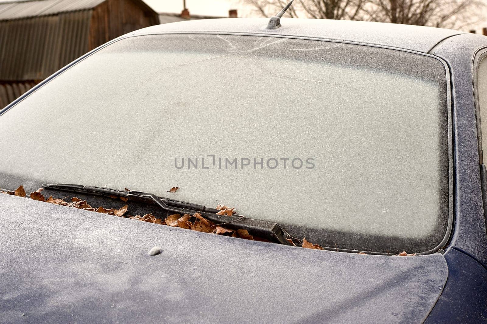 frozen windshield of a passenger car in winter. High quality photo
