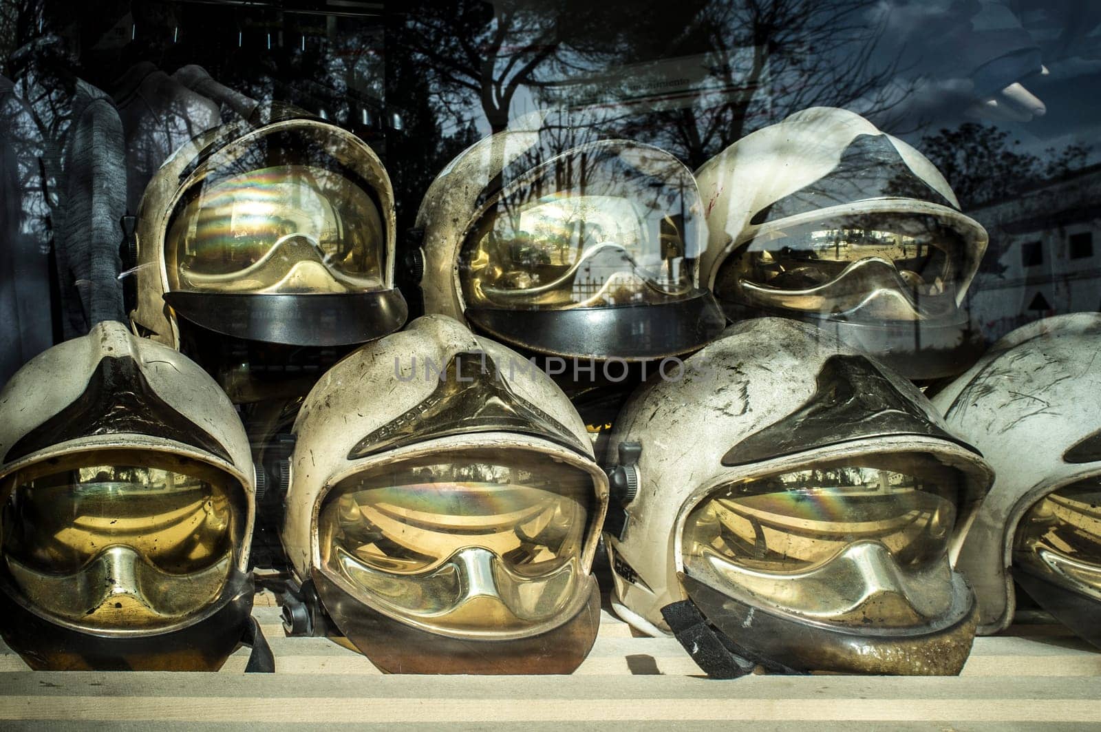 Pile of old firefighter helmets. Obsolete firefighter equipment