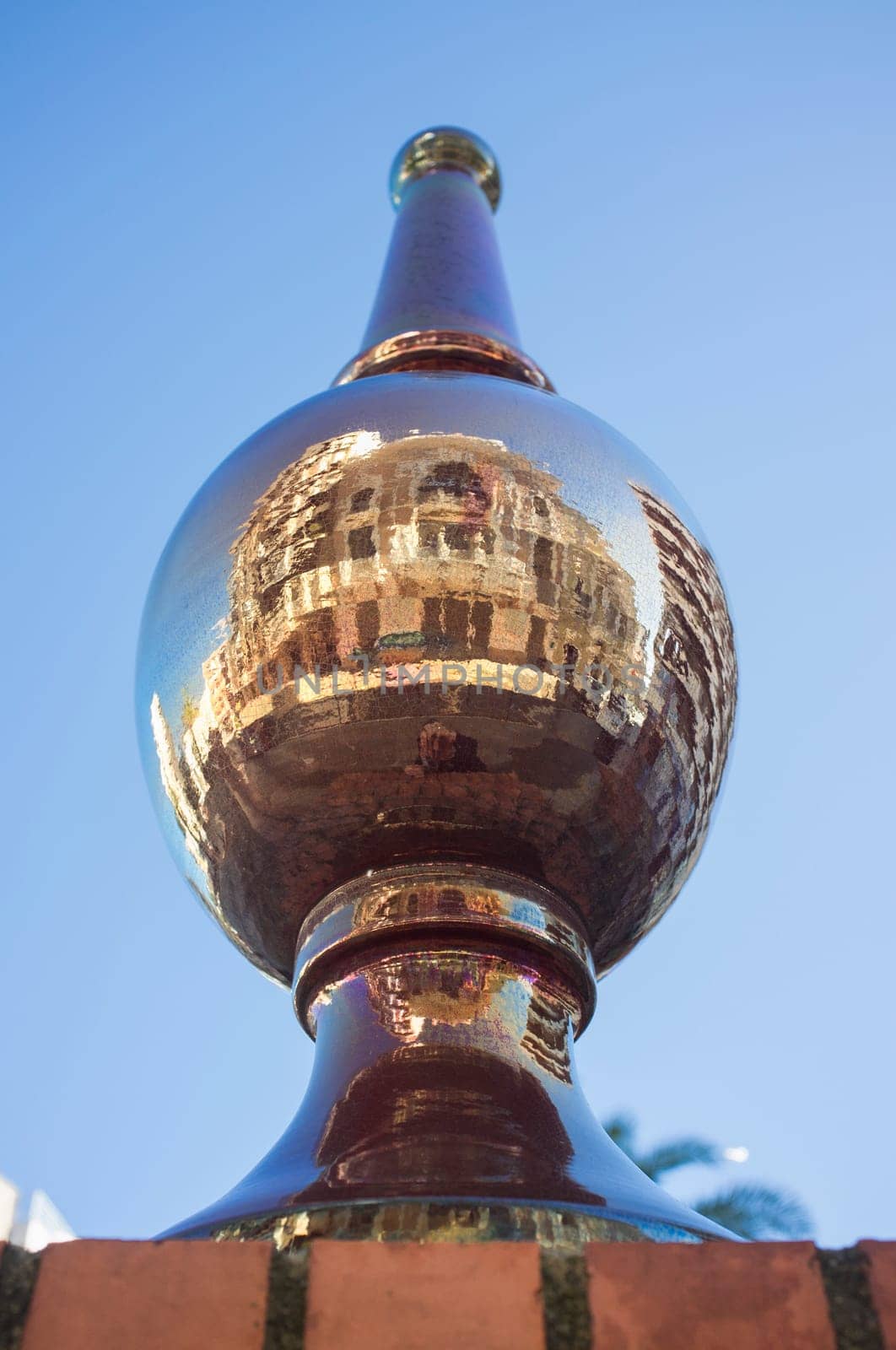 Ceramic pinnacle with Carolina Coronado Theater reflection. Espronceda Square, Almendralejo, Badajoz, Spain. Corner Balcony