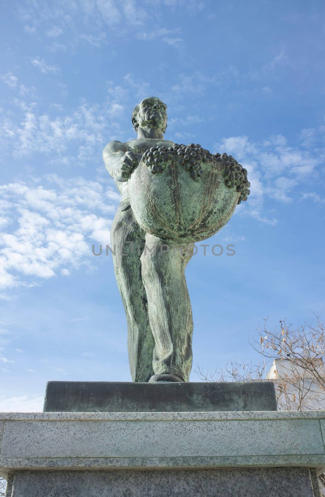 Almendralejo, Spain. January 29th, 2020: Vintager memorial statue. Sculpted by Diego Garrido in 1977. Almendralejo, Badajoz, Spain