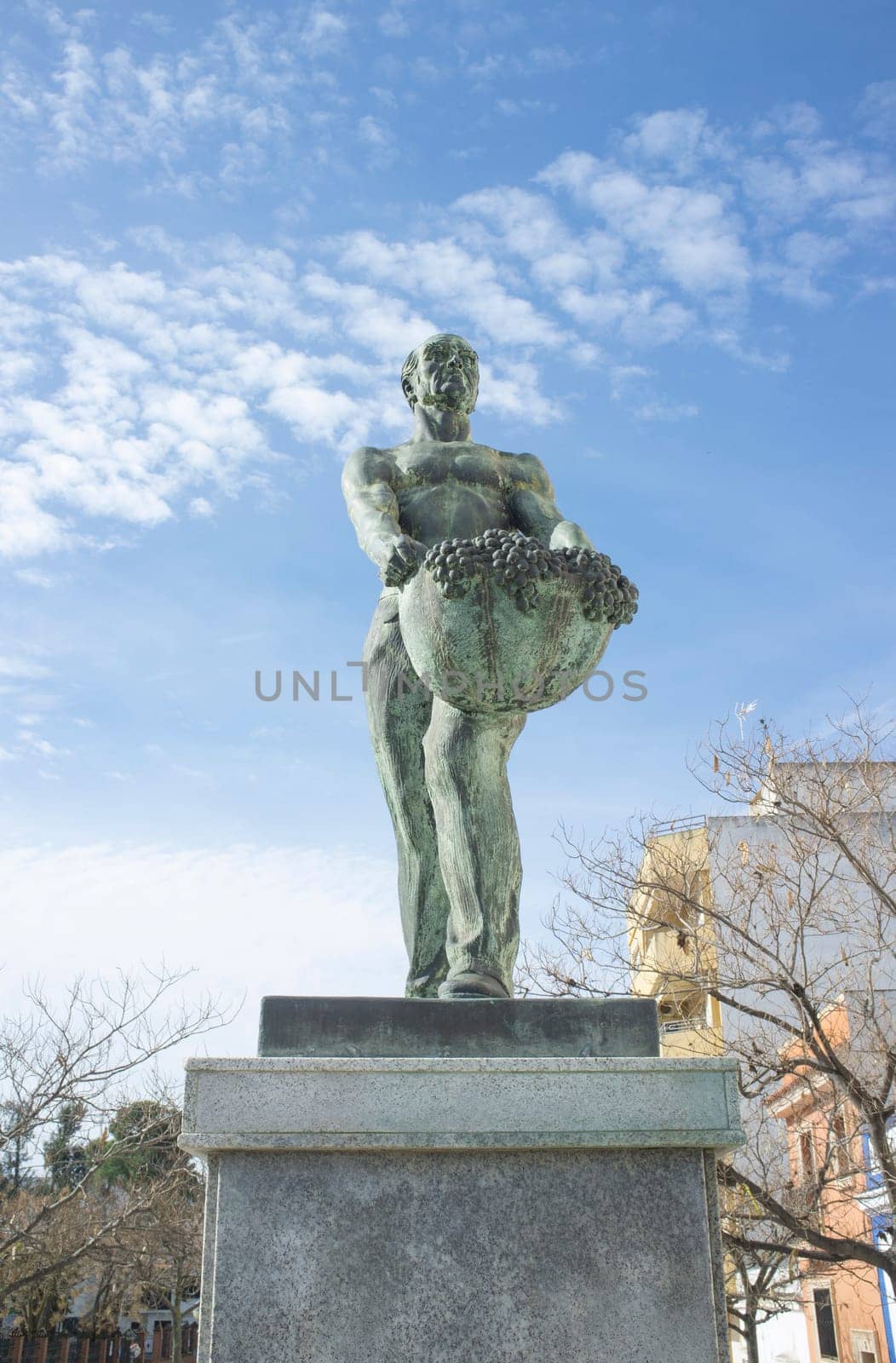 Almendralejo, Spain. January 29th, 2020: Vintager memorial statue. Sculpted by Diego Garrido in 1977. Almendralejo, Badajoz, Spain