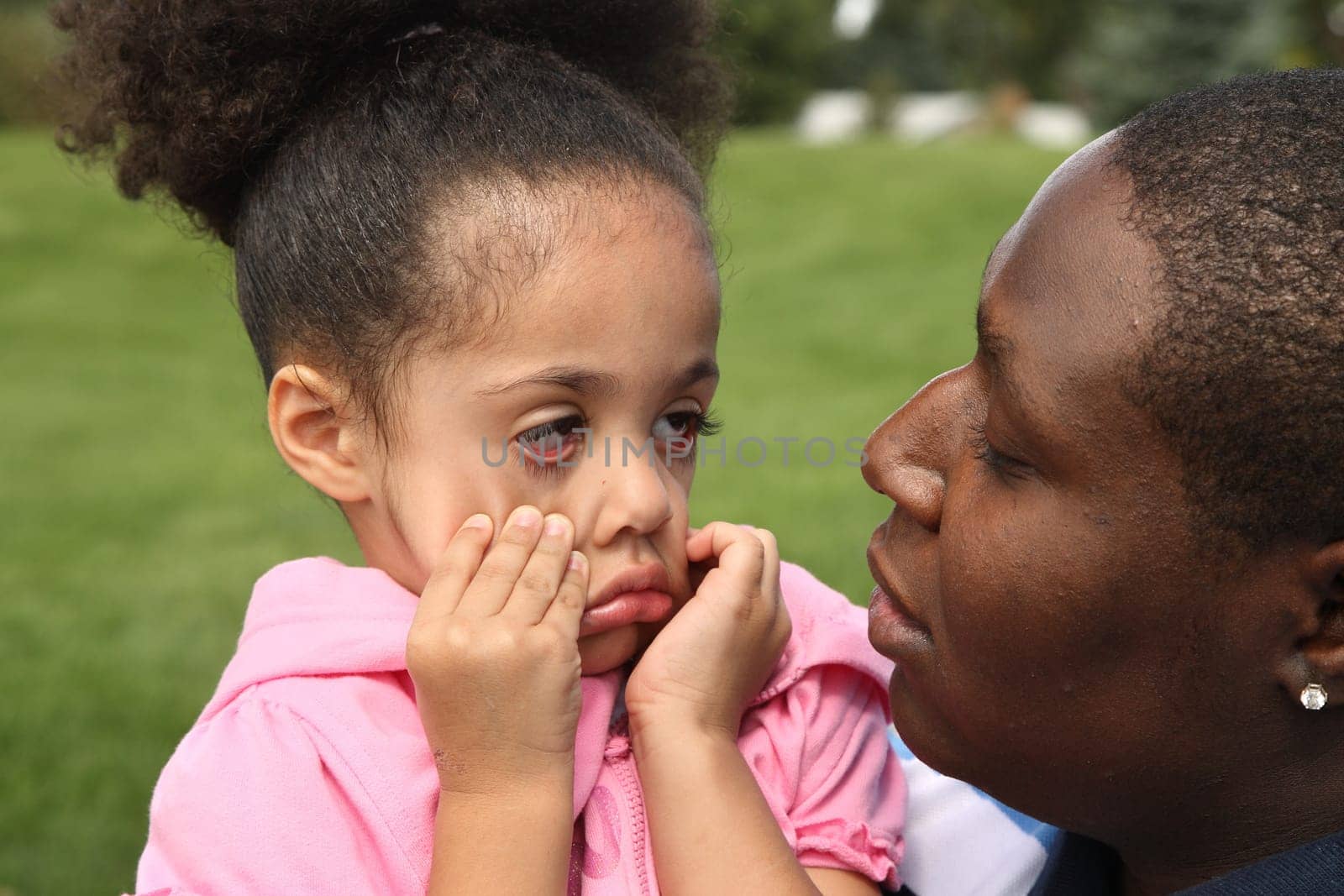 Father and child having fun in a park